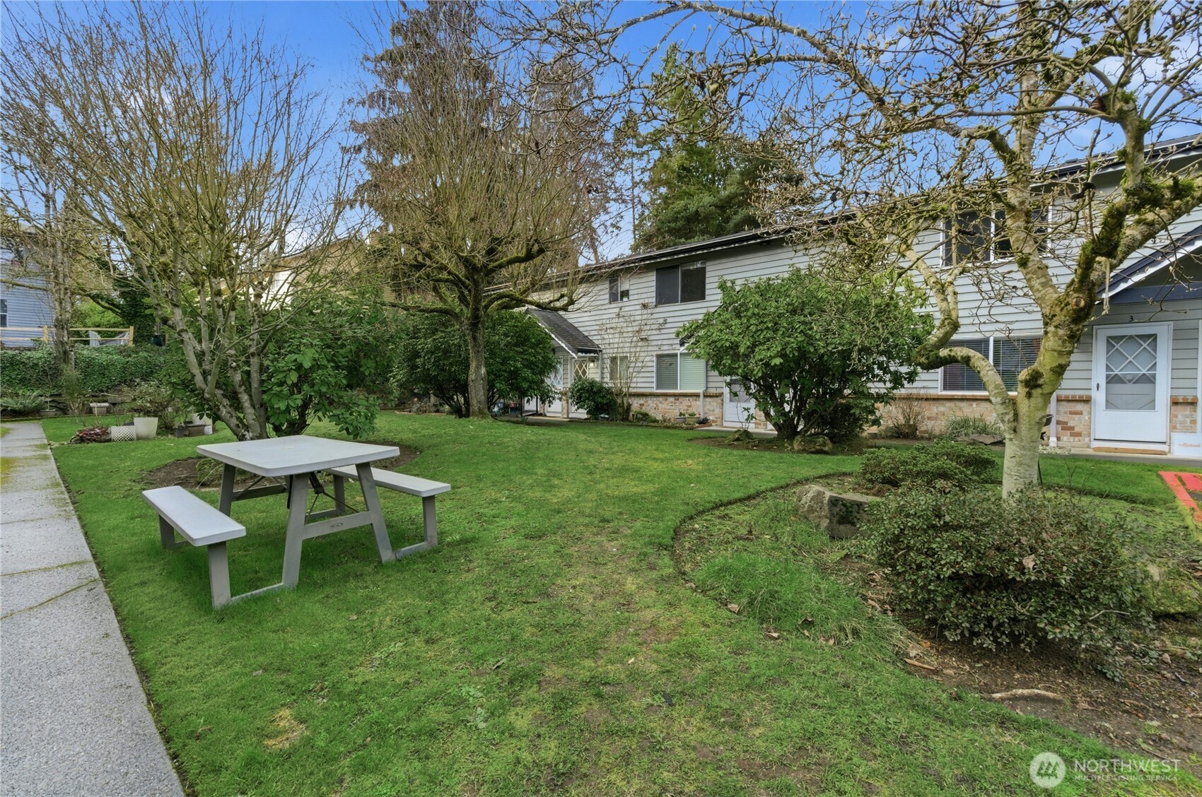 A boutique REMODELED gem privately nestled in colorful gardens & lush lawn in the heart of the best of Downtown Edmonds. The largest unit rarely available in this 14-unit darling townhome-style complex, yet central to everything for a fabulous lifestyle: 2 miles to quaint Downtown Edmonds hip shops/sips/eats, waterfront Marina Park (with an off-leash dog park), Anderson Playfield, 5 min to Yost Park with swimming pool/pickleball/tennis courts, ½ mile to Esperance Park with off-leash dog park. Private, separate entrance at the garden level leads to a beautiful, spacious floor plan with remodeled, bright interiors that live like a home: Huge living room (w/storage closet), sweet dining rm & eating bar, quartz countertops, shaker cabinetry, stainless steel appliances, LVP, updated bathrooms. Large Primary bedroom facing the backyard has 2 full-sized closets & office/sitting area space & Large 2nd bedroom near the 3/4 bathroom + 1/2 bath combo/utility room. Gourmet & everyday conveniences surround you: Costco, PCC, Whole Foods, Trader Joes, Kuzma Fish Market, QFC & Safeway, Swedish Hospital. A easy, breezy commute located 1 mile to Edmonds P&R, mins to I-5, and 10 minutes to the Lightrail Station! Maintained complex with newer windows, roof, plumbing, paint & ashphalt. TWO parking spots (#6 deeded & 1 uncovered) & THREE pets OK (under 30#). FHA & VA approved. No rental cap, strong HOA, low HOA dues. A trifecta of livability in one of Washington's favorite waterfront cities!