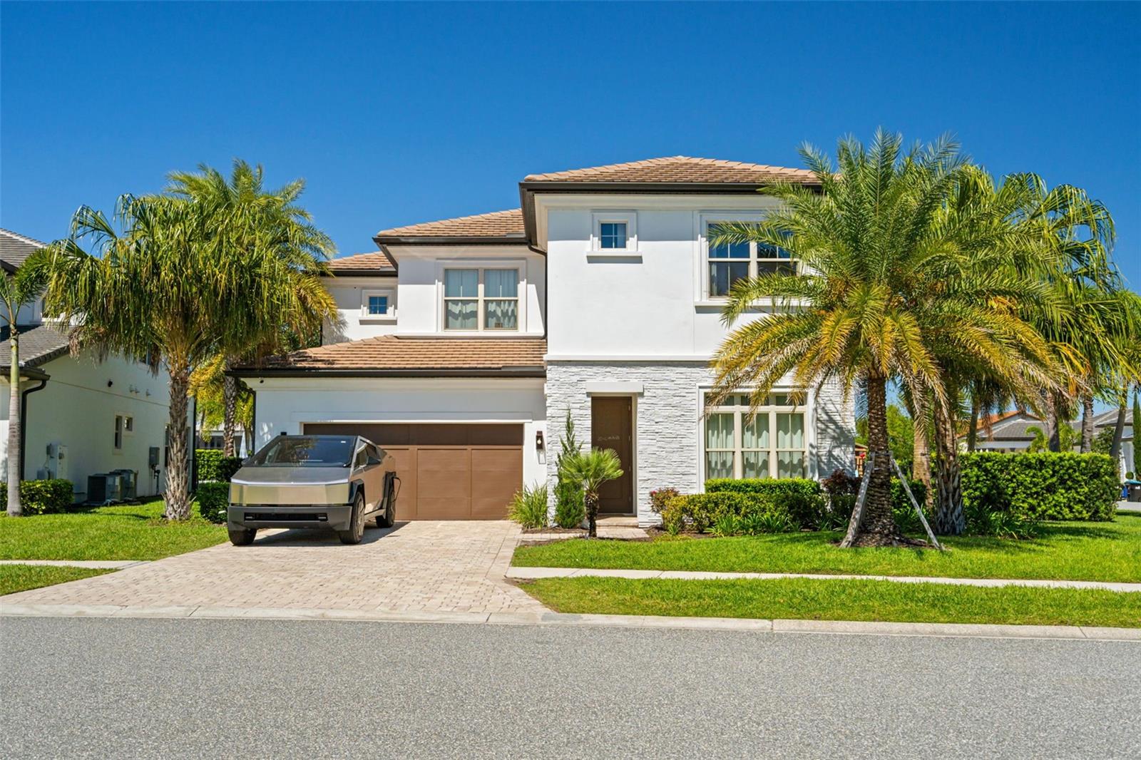 Under contract-accepting backup offers. Rare opportunity – listed significantly below the most recent sale of the same floor plan. This contemporary residence, built in 2021 by the award-winning Toll Brothers, offers valuable upgrades, an oversized corner lot, and a prime location within Royal Cypress Preserve – one of Orlando’s most sought-after gated communities. With over 150 additional square feet compared to the standard model, this home features 6 bedrooms, 5 full bathrooms, and 1 half bath, including two master suites – one on the first floor and another on the second – perfect for multigenerational living or flexible use of space.

Located in a prime area of Southwest Orlando, this home is zoned for top-rated schools, including Castleview Elementary, Horizon West Middle School, and Windermere High School – all known for strong academic performance and excellent community reputation. The property is just minutes from world-famous attractions such as Walt Disney World and Universal Studios, and less than 25 minutes from Orlando International Airport (MCO), offering exceptional convenience for frequent travelers. Residents also enjoy proximity to premium shopping and dining at The Grove, Winter Garden Village, and the Millenia Mall, as well as easy access to major highways like I-4 and 429, making commuting throughout Central Florida fast and seamless.

Highlights of the home include: expansive 0.26-acre corner lot (larger than the community average); extended covered lanai with a fully equipped summer kitchen, ideal for entertaining; custom cabinetry and high-end finishes throughout; exclusive landscaping with mature palms and privacy fencing; views of Disney fireworks; optional furniture package; and a premium location directly across from the 24-hour staffed security gate.

Royal Cypress Preserve offers 24/7 manned security, lawn care included in the HOA, a private boat ramp with lake access, and a luxury clubhouse featuring a fitness center, resort-style zero-entry pool, party room, and meeting spaces. A rare chance to own a highly upgraded, well-located home in one of Central Florida’s fastest-growing areas. Schedule your private tour today!