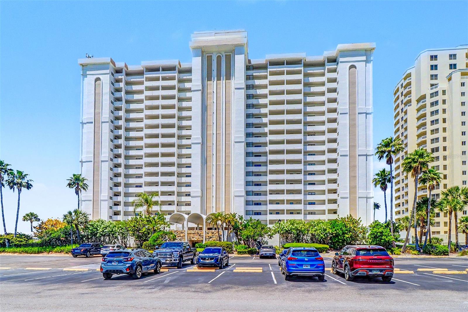 Fully furnished Gulf front condo with a Gulf view from all rooms!  Bright and open kitchen area with new appliances.   Updated flooring and some new furniture.    Large alcove balcony with railings on 2 sides provides extra southern exposure and privacy.   Walk-in closet.  New electric panel installed in March 2026.   Convenient storage locker across the hall from the unit.   Desirable assigned under building parking space with plenty of guest parking.  Locked & enclosed bicycle racks for owner to use on ground floor, plus outside semi-covered bicycle rack for tenant use.  Resort style amenities include large heated pool, hot tub, tennis/pickleball courts, shuffleboard, grilling area, plus a swing set for little ones.  Private composite boardwalk leads you to the beach.  Proficient on-site management and efficient maintenance and security staff.  24/7 gated security with guard.   All Milestone work has been completed.  Maintenance fees satisfy SIRS requirements, which reduce the need for future special assessments.   Excellent location with restaurants, shops, jet ski & boat rentals across the street.   Short walk or drive across Clearwater Pass to Clearwater Beach activities.  This move-in ready unit is ready to be enjoyed as a permanent residence, seasonal getaway or income producing beach gem.   Enjoy truly carefree beach living at its best!!!