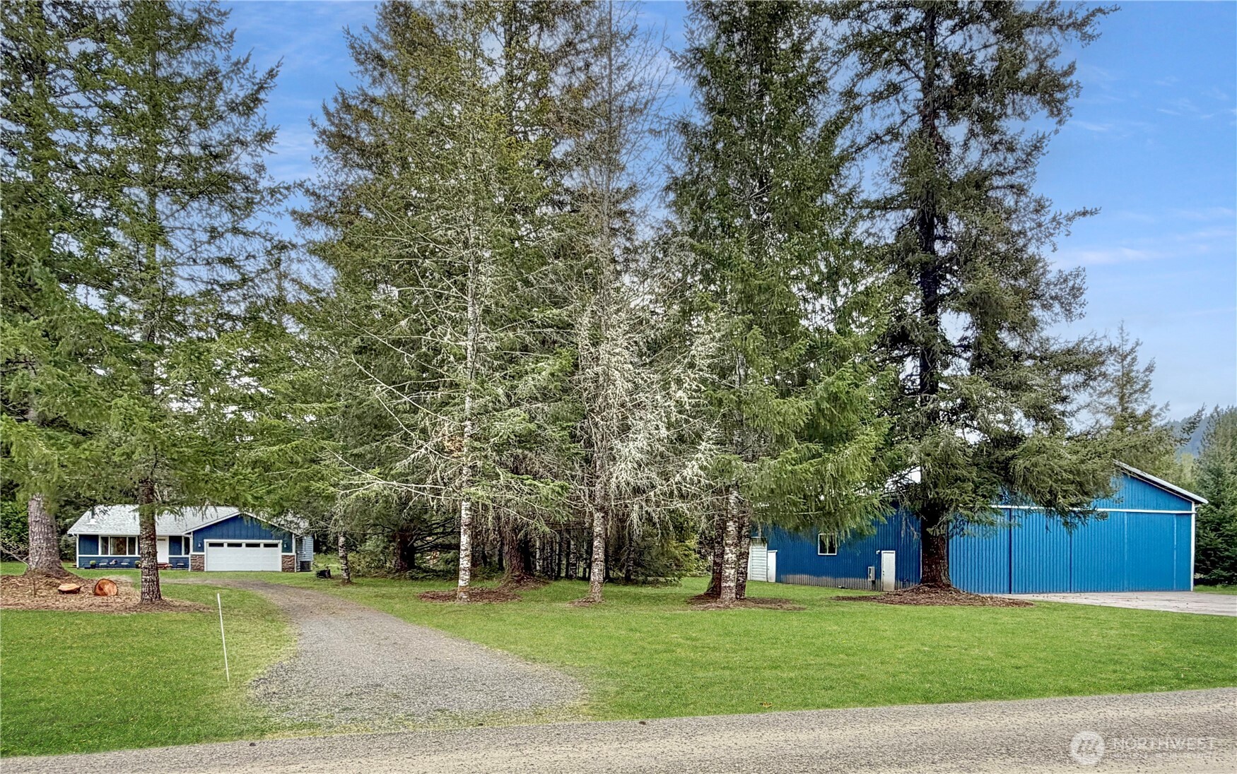 Live where adventure begins! Tucked inside the Randle-Kiona Airpark community, this rare 5-acre property offers the freedom, privacy, and adventure buyers dream about—complete with a beautiful single-level home and an impressive 60x60 airplane hangar. Whether you fly, collect toys, need shop space, or simply crave room to spread out, this property delivers. The 3-bedroom, 2-bath home features 1,664 sq ft of warm, inviting living space with an open-concept design, vaulted ceilings, skylights, large windows, hardwood floors, French doors, and a cozy wood stove that brings the outdoors in. The primary suite includes a private bath, while two additional bedrooms offer flexibility for guests, office, or hobby space. Wake up to peaceful territorial and mountain views, enjoy coffee in the quiet, garden in the sunshine, gather around the fire, or unwind beneath the gazebo after a day of adventure. The crown jewel of this property is the massive airplane hangar that offers incredible storage & flexibility for multiple aircraft, RVs, boats, equipment, vehicles, or a dream workshop. Utilities include a private well & septic. Low annual HOA fees. Located near the WN55 Randle-Kiona Airpark runway, this is a true fly-in lifestyle property just minutes from White Pass, Riffe Lake, Mayfield Lake, Mt. Rainier, Gifford Pinchot, flying, hiking, fishing, skiing, and endless recreation. A one-of-a-kind retreat where home, hangar, land, and lifestyle come together. Additional 5 aces available.