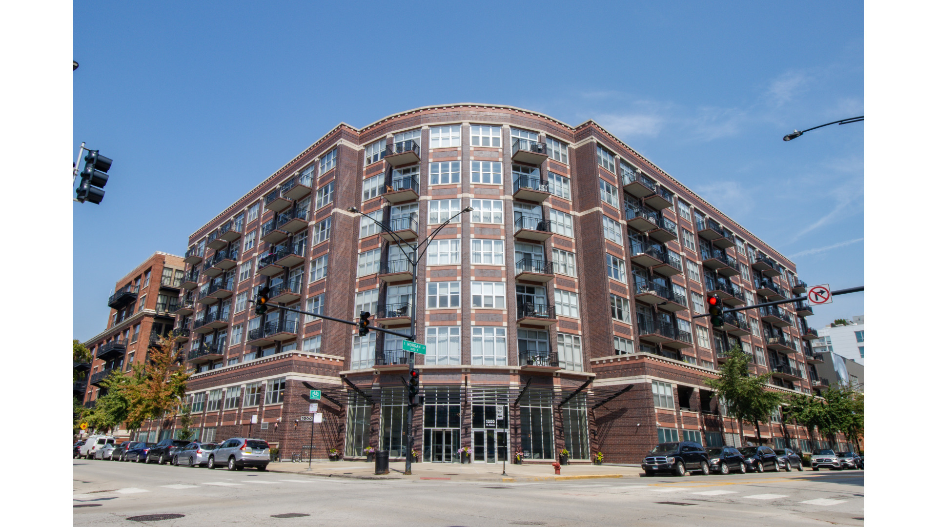 Stunning newly renovated south-facing condo in the heart of the West Loop. This beautifully updated 2-bedroom, 2-bathroom combines modern updates with timeless charm. Featuring an open floor plan and soaring ceilings, the lofted space feels bright, airy, and perfect for entertaining.  Enjoy the elegant refinished hardwood floors with light walnut stain and cozy tiled fireplace - perfect for relaxing or entertaining.  The brand-new kitchen features sleek 42" white soft close cabinetry, stainless steel appliances, and quartz countertops, and an island with overhang for eat-in seating.  The kitchen opens directly to a formal dining area with space for seating up to 8 and new light fixture. The primary suite features a wall of windows, brand new carpet, and glass walls allowing light to pass through while maintaining privacy.  Pass-through walk-in closet ready for your custom organizing ideas.  The oversized master bath has a new with double vanity, fixtures and mirrors, a large stand-up shower with sleek glass wall. Both newly renovated bathrooms boast contemporary fixtures and stylish tile work for a luxurious feel. Multi-purpose second bedroom with dual organized closets. Tandem garage parking an additional $30,000.  Large walk-in storage locker on the ground floor included.  Highly desirable full amenity building, including 24-hour door person, rooftop deck, fitness room and on-site management.  Close to restaurants, shopping and easy transit access.