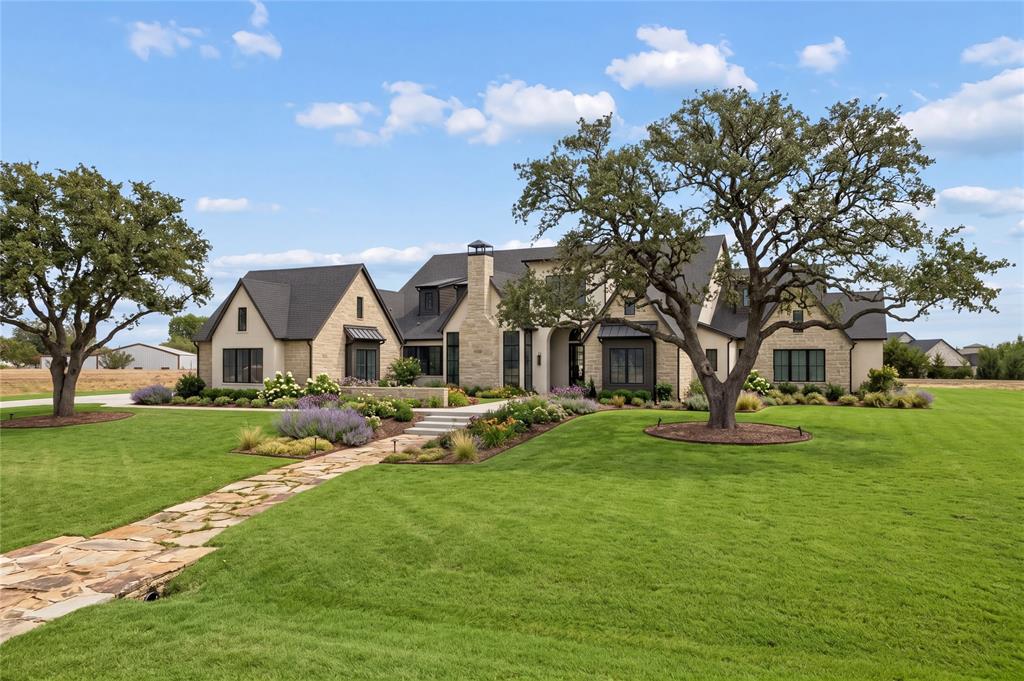 A striking, Modern European-inspired architectural estate by the renowned luxury home builder, Ron McHam. Situated on a premium, 1.1-acre private cul-de-sac lot in prestigious Chamberlain Park. This exceptional single-story residence makes an unforgettable first impression with a grand foyer, soaring ceilings, dramatic oversized fir beams, modern steel and glass entry, and expansive Anderson glass window wall systems that flood the home with natural light while seamlessly connecting the interior to outdoor living. Thoughtfully designed for exceptional entertaining and everyday living, this floor plan offers a great room, dining area, chef's kitchen with a complete Thermador Professional appliance package, full prep kitchen, wet bar with wine display chiller, private study with fireplace, media room, gym, and a separate entertaining wing featuring a spacious cabana room with vaulted ceilings, stone fireplace, and expansive sliding walls of glass opening directly to the resort-style outdoor living. With an adjoining bedroom suite and private garage access, this flexible space is ideal for guests or multigenerational living. The opposite private wing leads to the primary suite with dual spa-inspired bathrooms and oversized custom closets. The remaining two bedroom suites occupy their own separate wing. All millwork was custom created exclusively for this home. Crisp overlay custom cabinetry, custom shaker moldings and trim, transitional light-stained oak floors, and hand-troweled slick-finish walls. Outdoor living spans more than 1,000 square feet with a modern designed pool and spa, outdoor kitchen, dining area, and multiple living and gathering spaces. The oversized four-car garage adds approximately 1,550 square feet of covered space. Full foam encapsulation and Energy Star certification. Currently in the final stages of construction, this extraordinary residence offers the rare opportunity to secure one of Fairview's finest new luxury estates before completion.