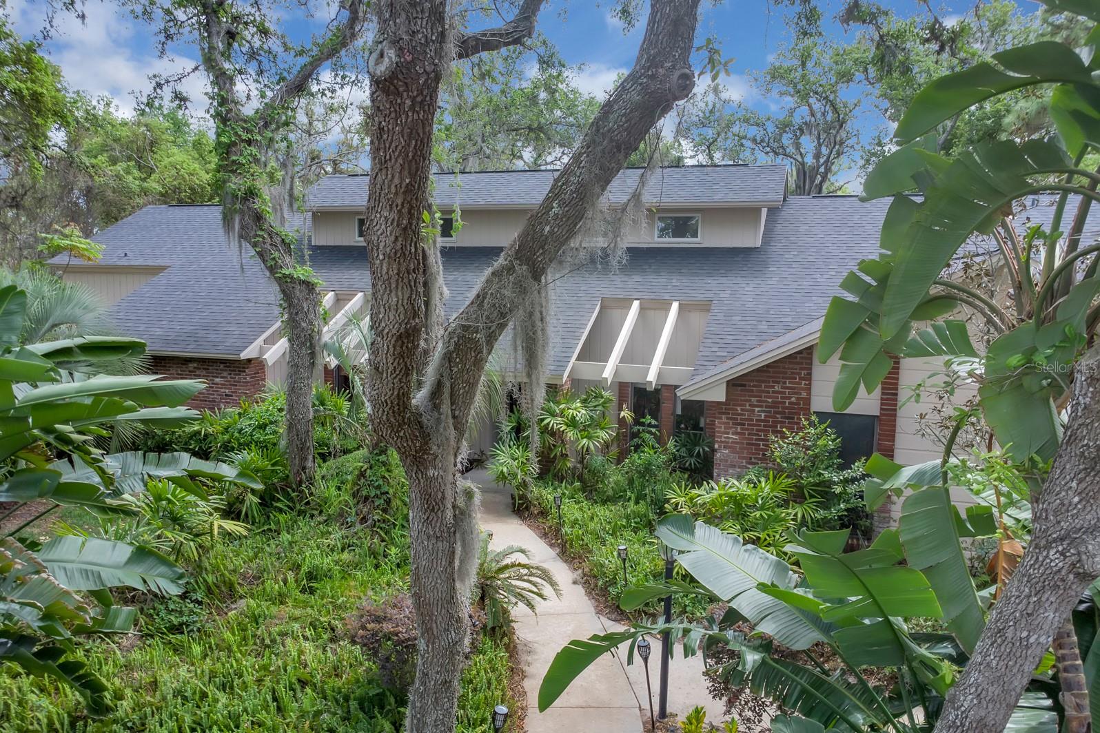 Welcome to this great Sweetwater Oaks home!! This expansive 4 bedroom, 3 and a 1/2 bathroom home has so much to enjoy!! The home is located on a quiet street and surrounded by beautiful tropical landscaping on the private .55 acre low maintenance lot! The interior of this home features split plan bedrooms, 3 full bathrooms, a pool bathroom, a private bathroom shared between two bedrooms(Jack and Jill) a convenient and classy half bathroom, soaring ceilings, an amazing wood burning fireplace in the main room, the spacious home office is private and quiet with French Doors, the room sizes are huge and storage space is abundant! The upstairs loft currently is a great hideaway but could be a game room/office/study/5th bedroom/hobby room/etc!! The kitchen is ready to go with a very nice banquette and built in appliances! The back porch is one of the largest in the community and perfect for relaxing by the giant solar heated lagoon pool or hosting the largest gathering! The side entry garage is oversized and measures 576 square feet, room for cars and toys!! The home was just replumbed, the AC units are newer, the roof was replaced in 2020, the solar pool heating system replaced in 2021. The home is carpet free, low maintenance ceramic tile and laminate flooring makes life easier!!Come home and enjoy all the unique and wonderful Sweetwater Oaks amenities all with low annual HOA dues!! These amenities include access to Sweetwater Beach at Lake Brantley which offers a beautiful park and beach as well as a covered pavilion for gatherings, boating, water skiing, fishing, sailing, kayaking and fun!Eight tennis courts, 8 pickle ball courts, sand volleyball at Sweetwater Beach, many parks, multiple playgrounds, a beautiful community center and many community events for everyone!! Access to the Wekiva River is right down the street at Riverbend Park, enjoy soccer, baseball, kayaking, canoeing, fishing, the picnic and party pavilion, or nature walks and much more! The schools are the best in the area; Sabal Point Elementary School, Rock Lake Middle School and nationally ranked and highly regarded Lake Brantley High School!! The location, quality and condition are right, call today to see this great home!!