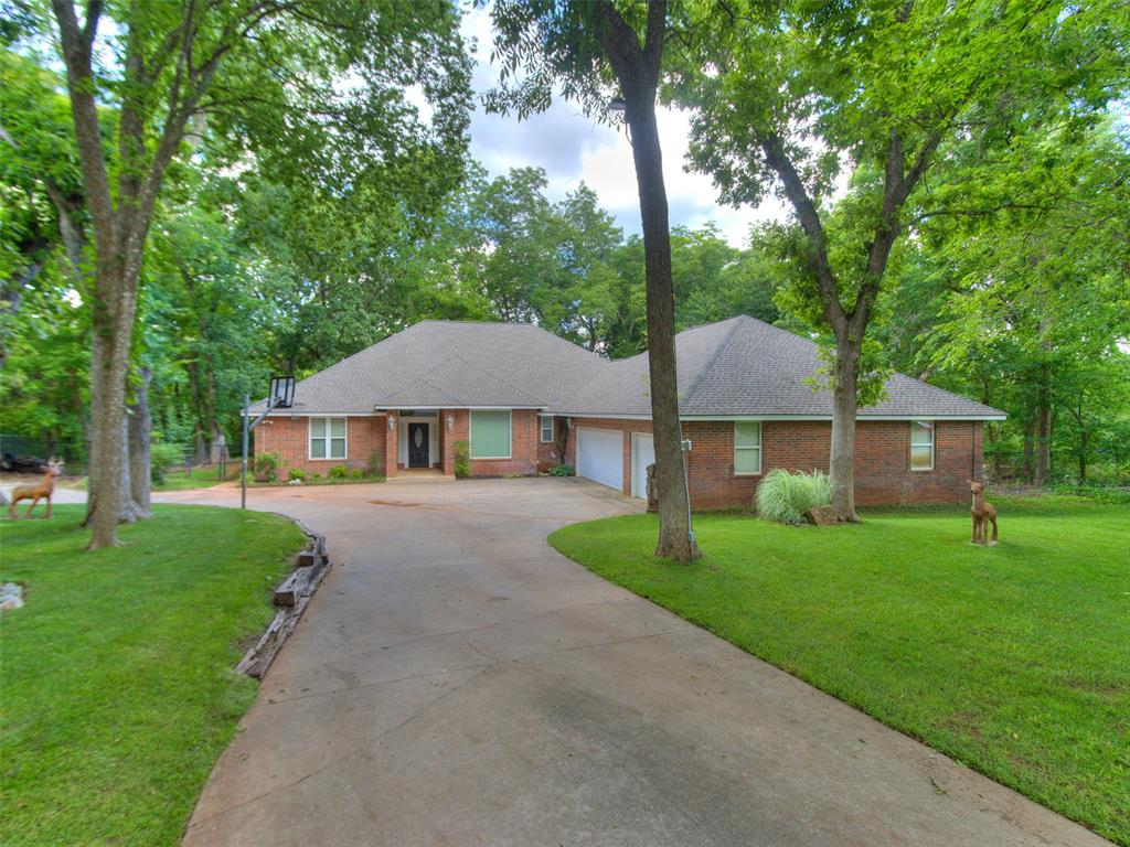 Nestled on 2.7 acres (mol) in the scenic Highland Hills neighborhood, this private retreat offers space, serenity, and a strong sense of community. Enjoy your own private dock, mature trees, and direct access to neighborhood walking trails and two stocked ponds—home to bass, catfish, and crappie. Inside, you'll find 2,907 sq ft of well-designed space featuring 3 bedrooms, a dedicated office, and two spacious living areas—ideal for entertaining, working from home, or creating a media or playroom. The expansive primary bedroom boasts four generous closets, offering ample storage and organization. Expansive windows offer tranquil views of the wooded backyard, where a fire pit awaits for cozy evenings outdoors. The home offers practical upgrades including a geothermal HVAC system, two newer water heaters, a 2020 roof with GAF class 4 shingles, new carpet in the bedrooms, and an oversized 3-car garage. The convection cooktop and ample kitchen space make entertaining easy, while the detached shop—complete with its own bathroom—adds extra versatility. While some interior elements reflect a more traditional style, it’s the perfect canvas for the new owner to add their personal touch and make it truly their own. Outdoor living, indoor comfort, and room to grow—all in a peaceful, nature-filled setting just minutes from town.