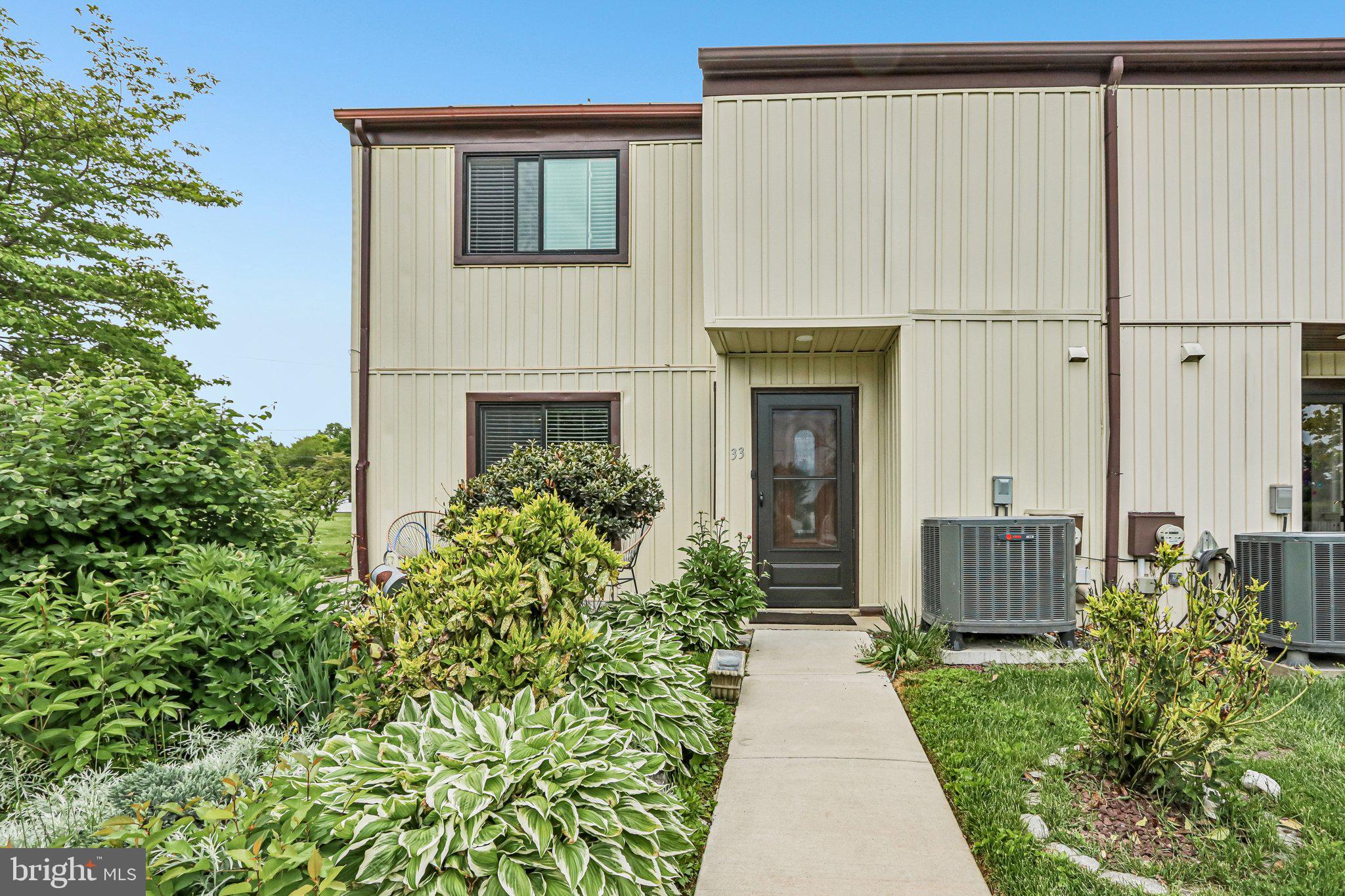 Freshly painted in natural designer colors and truly move-in ready, this bright end-unit townhome offers exceptional privacy with two acres of common ground surrounding the property! Enjoy outdoor living with oversized front and rear stone patios connected by a 4-foot-wide custom stone walkway.Major exterior renovations completed between 2024–2026 include brand-new vinyl siding, house wrap, OSB sheathing, insulation, oversized Jeld-Wen windows, Andersen sliding glass patio door, staircase carpet, recessed lighting, ceiling fans, new heat pump, new 50-gallon water heater, and an added third full bathroom on the main level.The spacious interior features new luxury vinyl plank flooring in the living, dining, and family rooms, plus engineered hardwood flooring in the primary bedroom. Generous closet space, pantry storage, and an unfinished walk-in attic with new folding attic stairs provide excellent storage options.The kitchen was beautifully updated with hardwood cabinetry, granite countertops, stone backsplash, added 42” wall cabinets, extra base cabinetry, and newer LG appliances (2023).Upstairs bathrooms were fully remodeled with updated plumbing, vanities, mirrors, lighting, natural stone finishes, glass shower doors, and upgraded tub/shower areas.Additional updates include a newer roof (2017). Conveniently located near SEPTA and Amtrak, shopping, restaurants, parks, and just 12 minutes to Marsh Creek State Park and lake recreation.