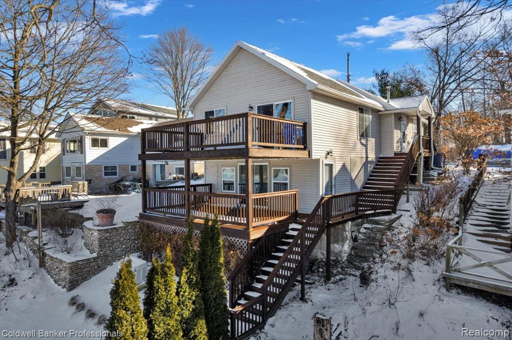 Whether you are looking for the ultimate summer playground or a perfect year-round sanctuary, this multi-level lakefront home on all-sport McKane Lake is the perfect blend of "cabin cozy" and modern living. The beautiful home features an expansive upper-level living area where knotty pine ceilings meet a contemporary open floor plan. This space is anchored by a large kitchen island that serves as the natural site for morning coffee or hosting friends after a day on the water. The layout of the home provides plenty of room for everyone to spread out. The main level hosts the primary suite, an updated bathroom, and a bright guest bedroom. On the lower level, you will discover a spacious family room, bonus room, a flexible space that serves perfectly as an optional third bedroom as well as laundry and half bath. Both the main-level living room and the lower-level family room feature walk-out porches, offering seamless transitions to the fresh air and stunning views of the lake. This home is as reliable as it is beautiful, featuring a long list of recent updates for total peace of mind. The interior shines with new flooring, while the essential systems—including the central air, furnace, roof, and water softener—have all been well-maintained. Significant 2025 upgrades include a brand-new Generac generator, a new lakefront shed for all your gear, new soffits fascia and gutters as well as freshly stained decks and entryways. Life on McKane Lake means embracing the best of the all-sport lifestyle. You can spend your afternoons jet skiing and your evenings watching the sunset from either of your private decks or by your lake side firepit. With ample storage throughout and a prime location right on the water, this home is ready for you to move in and start making memories. Don't let another season pass you by, come see why life is better at the lake.One Year Buyer PREMIER Home Warranty included!*Pontoon and furnishing are available as a separate sale through the owner.