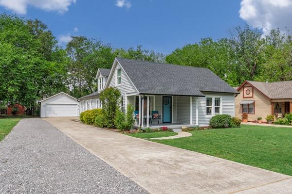 Charming 1940-built bungalow with extensive updates, located approximately one mile northwest of the University of Oklahoma campus, Campus Corner, and Historic Downtown Main Street. This well-maintained home features a spacious living area with abundant natural light and an open layout connecting the kitchen and dining spaces. The kitchen offers updated appliances and tile flooring, while refinished original wood floors add character throughout the main living areas. An extensive list of recent upgrades is available. The upper level provides flexible space for a home office, bonus room, or additional living area.  Plenty of space for two cars plus storage in the detached garage with a  large drive with ample parking. A rare opportunity to own a thoughtfully updated home in a central Norman location.