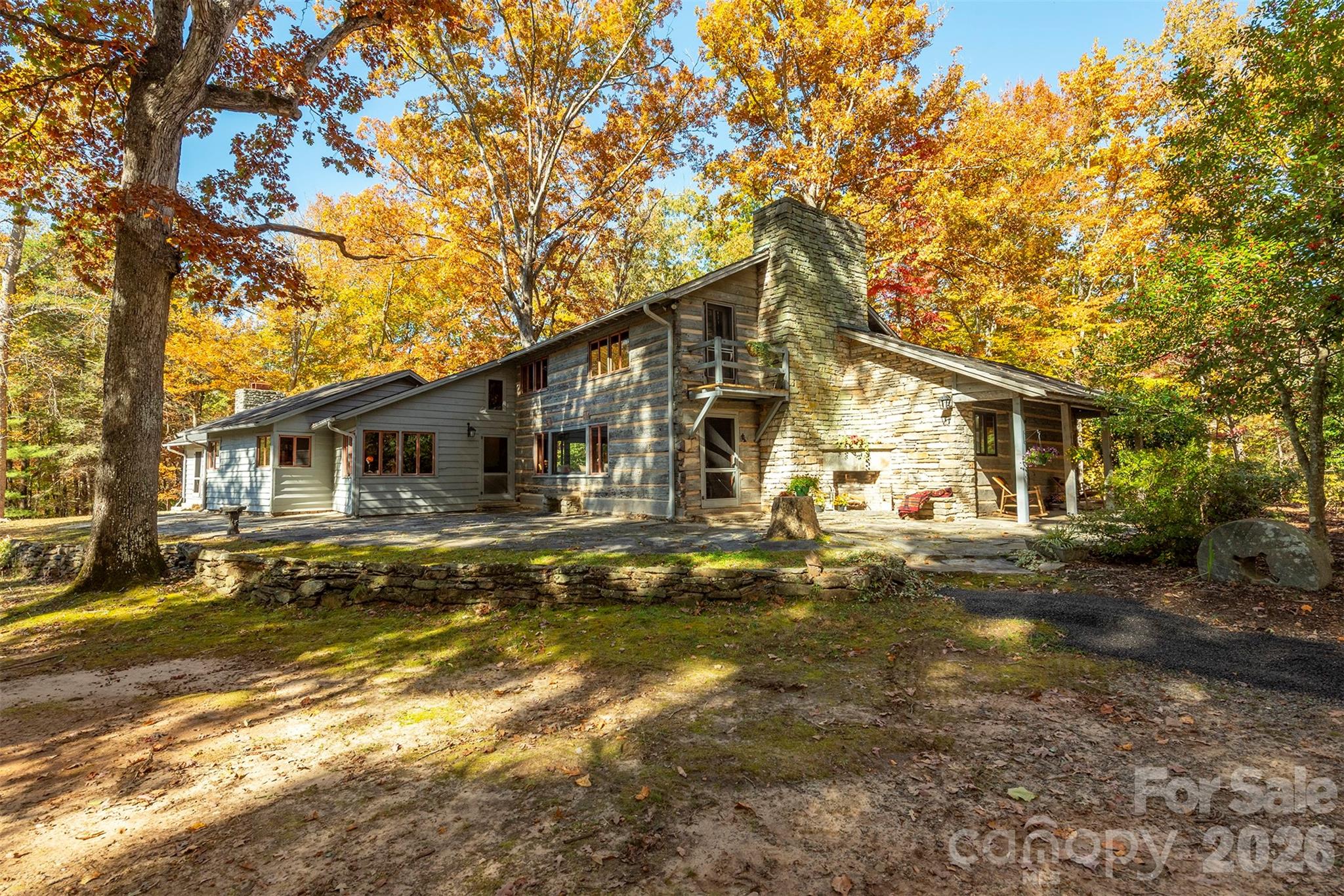 A RARE opportunity to own a true Western North Carolina icon on beautiful, easy-to-build acreage, just minutes to downtown Columbus!! This distinguished family home—constructed with logs transported from a cabin in Tennessee—is steeped in local history and timeless character. Long celebrated as a gathering place for the community, the property spans 18.27+/- picturesque acres, with the option to purchase additional surrounding land. The 18.27-acre parcel is part of a 55-acre parcel that will be surveyed and divided prior to close. See MLS #4295084. Purchase the home with 4.5 acres. See MLS #4211548.  Contact listing agents for details.Ideally located within walking distance of downtown Columbus and just minutes from I-26, this estate offers convenient access to Asheville, Greenville, SC, and three major airports—perfectly balancing historic appeal with modern accessibility.Step back in time and imagine the possibilities! This historic home features five fireplaces, a magnificent hand-laid rock chimney, a slate roof, and wormy chestnut details throughout, showcasing the masterful craftsmanship of a bygone era.The pastoral setting, combined with wooded privacy and sweeping grounds creates endless potential. Restore it as a grand private estate with ample surrounding acreage, design a multi-generational compound, build multiple rental units or create a communal living compound.  Convenient access to city water and sewer make the options countless! (Tax records currently reflect 55 acres).