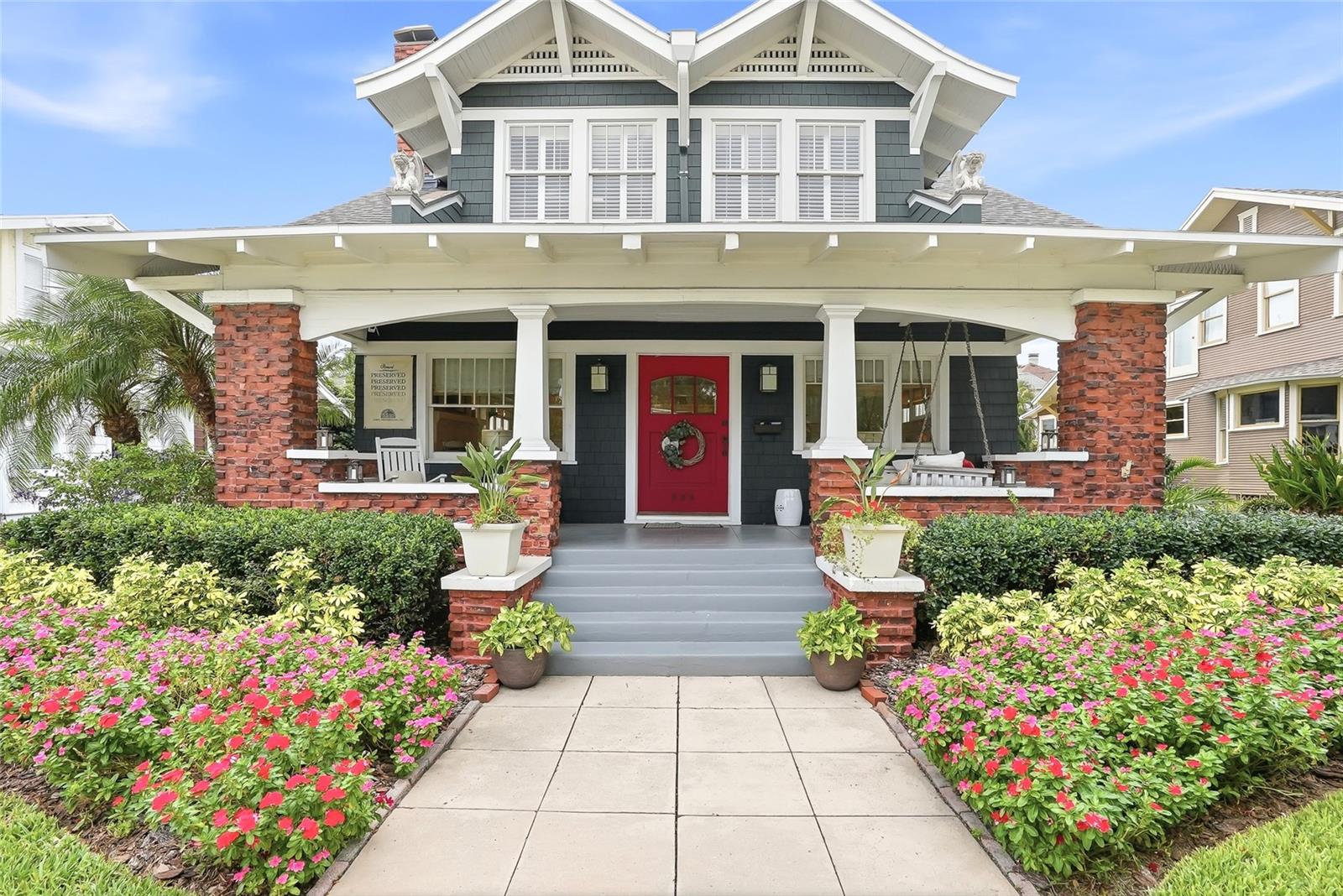 Wonderful cedar shake home and carriage house. 4 bedrooms and 4 baths craftsman pool home with rare "Clinker brick" front porch and chimney, in the heart of Hyde Park. Only five doors from Bayshore Blvd in sight of the water and beautiful 3 mile pathway! Hyde Park Village is also only 2 1/2 blocks away. The 3140 square foot house has great attention to detail. Box beam ceilings, custom millwork and built-ins can be found throughout. The kitchen and bathrooms, as well as parts of the master bedroom and family room, were designed by the local firm "Interior Spaces". This is a true Bungalow yet redesigned to meet the needs of today. Upon entering the 48 inch wide Craftsmen front door, you find an open living and dining room floor plan, with gas fireplace. The large eat in kitchen and family room area flow to the back porch and stone courtyard with 8 X 18 cocktail pool & waterfall. There is a full bath downstairs also. Upstairs are 4 light filled bedrooms with plantation shutters. The master bedroom has dual closets and built-ins. The master bath has a seamless glass shower, soaking tub and double sinks. The second bedroom is en suite. Bookend bedrooms 3 and 4 have nice morning light. The third bath feels like a second master in design and style. This signature home has been well maintained and updated, including a kitchen renovation in 2023 - 2024. Carriage house apartments are 550 sqft each. The bottom was renovated in 2024 (same quartz countertops as main home). The second bedroom could be used as an office, overlooking the pool. The top has a cute screened in porch also overlooking the pool. Transferrable warrantees include the roof and termite plan.