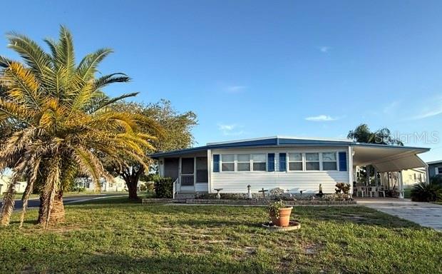 Corner lot, newer roof! Welcome to easy Florida living in the highly desirable and active Lake Tarpon Mobile Home Village 55+ golf cart community where you OWN YOUR LAND. This spacious home has 2BR/2BA with plenty of closet space! The living/dining area is ideal for entertaining and the kitchen has plenty of storage and counter space to prepare your favorite meals. The large corner lot makes a perfect canvas to showcase your green thumb. Laundry facilities are inside the home. This is a very active community that offers a lot of events and activities. It boasts a heated pool, large club house, shuffle board, bocci ball, golf net, dock, boat ramp and other amenities. Enjoy the social activities that include dances with live music, concerts, karaoke, ice cream socials, pancake breakfasts, craft club, golf club, line dancing, Veteran's club, water aerobics and much much more. This community is active all year round. Call for a showing today!
