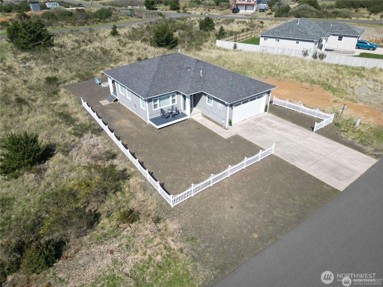Move-in ready, this 1,288 sq ft home is located in a quiet Jetty neighborhood and offers a light-filled, open-concept layout.  Interior features include wood-grain ceramic tile flooring, propane fireplace, KitchenAid stainless steel appliances, gas  range, granite countertops, pantry, and island with bar seating. The primary suite includes a walk-in closet, additional  storage, and an ensuite bathroom with double vanity and fully tiled shower. Additional features include a dedicated  laundry room, on-demand propane hot water, central heating and air conditioning with heat pump, custom window  coverings, and an attached 2-car garage. Close to Jetty and beach access, with potential to enjoy ocean air, coastal  surroundings, and sky views throughout the day. Suitable for full-time living, second home use, or investment.