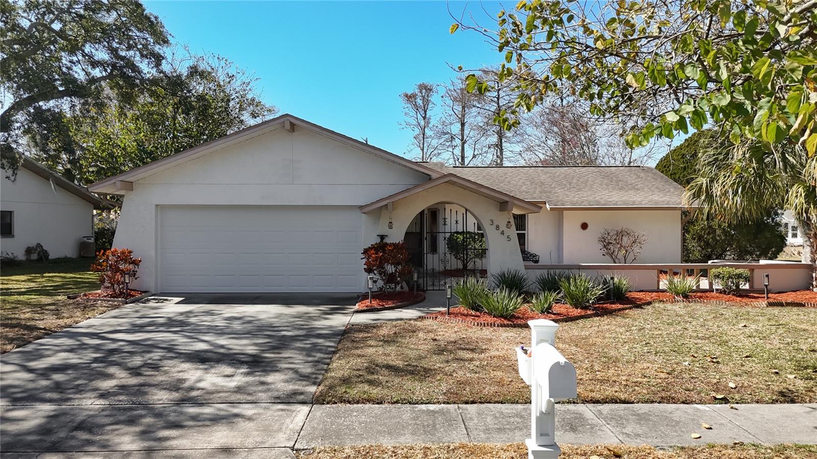 GREENBROOK ESTATES – Are you ready to enjoy the Florida Lifestyle? This 2 bedroom, 2 bath, 2 car garage home is located on almost a quarter acre lake front non-flood zone lot with views of an amazing bird sanctuary. This serene environment is the perfect setting to relax and enjoy your morning coffee or your evening beverage on the screened lanai or paver patio area. The open floor plan is perfect for entertaining and allows tons of natural light to bathe the space while the ease of flow is perfect for entertaining. The central living space has breathtaking views of the lake and frolicking wildlife, while the split plan is perfect for privacy with family or guests. The primary suite is complete with a large walk-in closet and spacious en suite; while the secondary bedroom has double closets and private access to the hall bath. Laminate flooring throughout the main spaces provides for easy maintenance. HVAC with UV light 2023, New ductwork 2026, fresh interior paint, most windows updated, gutters with guards. The sprinkler system is fed from the lake, so no high water bills during our dry months. Elevated out of the Flood Plain into Flood Zone X! Desirable school zones. Close to shopping, restaurants, and entertainment. Make your appointment today to visit this tranquil property and begin relaxing immediately!