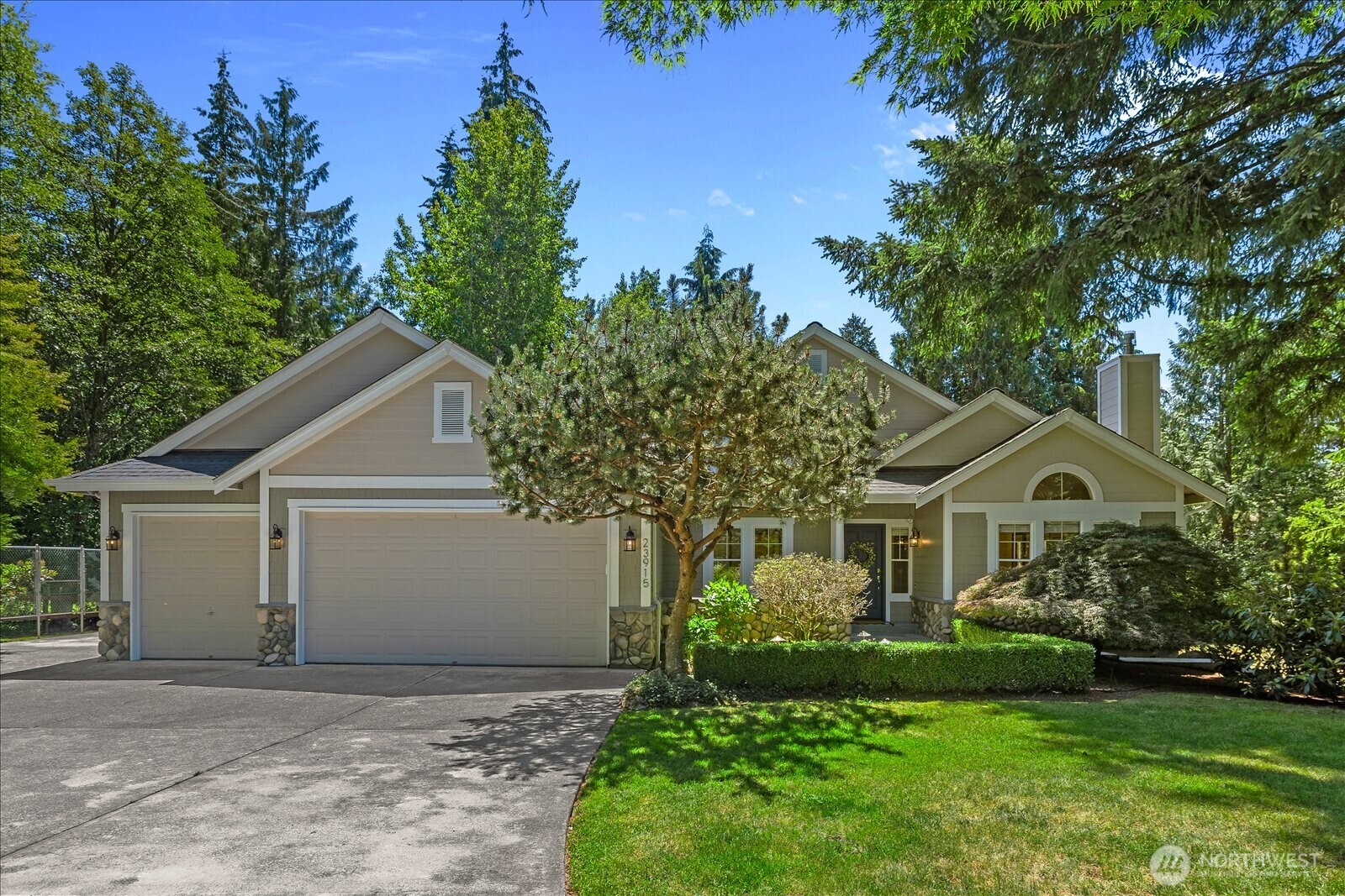 New price=Amazing value! Nestled on a beautiful 1.29-acre level lot in Redmond’s coveted Union Hill neighborhood, this custom-built 4- bedroom rambler offers privacy, comfort + timeless appeal. A circular driveway welcomes you to this one-owner home, surrounded by a breathtaking park-like setting. Thoughtfully designed with generous living spaces, the home features formal living room w/gas fireplace, dining room, a spacious cook’s kitchen with ample cabinetry, gas cooktop, and sunny breakfast nook overlooking the backyard. The adjacent family room includes a second gas fireplace and access to the expansive deck. The primary suite features a 5-piece bath, while 3 additional bedrooms, a full bath, powder room, and large laundry room with bonus shower complete the home. Towering cedars create a serene backdrop, and the expansive grounds offer endless opportunities for entertaining, gardening, recreation, or relaxation. Gardeners will appreciate the established plantings and greenhouse. A third garage bay serves as a workshop, and a large backyard shed provides extra storage. Plenty of parking for RV, boat and all of your toys! The fenced backyard is wired for an invisible fence and offers plenty of space to play and gather. Enjoy peaceful country-style living just minutes from top-rated Lake Washington schools, major employers, shopping, dining, and entertainment. A rare opportunity to own an exceptional home on a truly remarkable property. Enjoy the best of one-level living.
