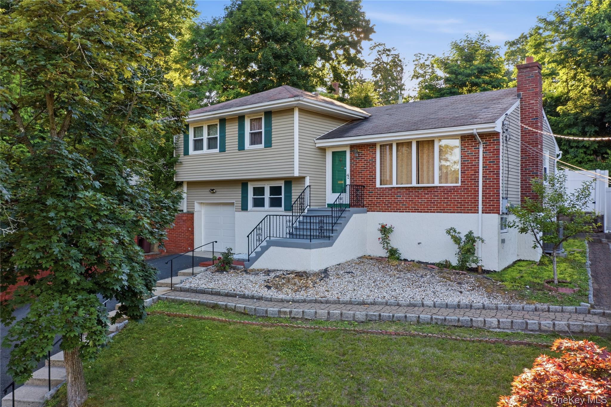This charming split level home is nestled on a quiet cul-de- sac. The hardwood floors throughout make this place really feel like a home.  With a large living room and great dining room space, this home is fantastic for entertaining! The home also includes three nicely proportioned bedrooms, a large patio, fenced in backyard, updated bathrooms, vinyl siding and a 1 car garage. Centrally located in Yonkers, the Untermyer Gardens, Stew Leonards and Ridge Hill Shopping Center are just a short drive away. The square footage does not include lower level or basement.