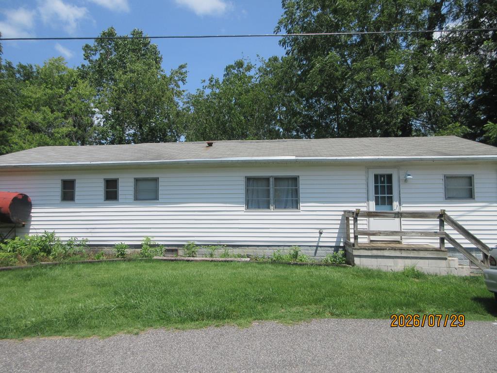 Great place to start out in this mobile home with an addition built on.  3 bedrooms, 1 bath.  covered porch on the back.  Surrounded by mature trees.  Out building and large open lot.  Surrounded by mature trees.