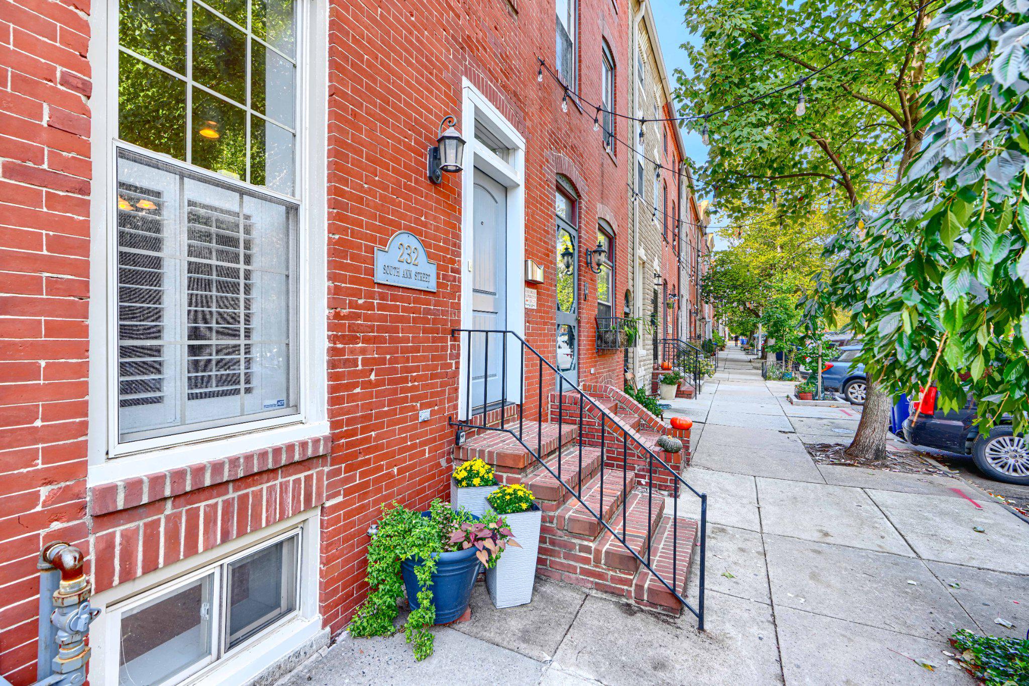 Beautiful 4-level townhouse in Historic Upper Fells Point (built in 1900) seamlessly blends historic charm with modern upgrades across more than 3,000 square feet of living space. Step inside to a spacious, open floor plan featuring warm hardwood floors, abundant natural light, and elegant crown molding throughout.With multiple outdoor spaces, spa-like baths, and over 3,000 square feet across four levels, this home offers a rare combination of space, comfort, and city living.The heart of the home is a beautifully updated kitchen with granite countertops, stainless steel appliances, and ample table space—perfect for everyday living and entertaining. The home offers three bedrooms and three and a half baths, including two spa-like suites: one with a jacuzzi soaking tub and oversized walk-in shower, and an upper-level suite featuring a spacious two-person shower. Both suites include generous closet space.The fully finished basement provides versatile additional living space—ideal for a media room, home gym, office, or guest room. Two decorative brick fireplaces add character and charm.Outdoor living is a standout feature, with three levels of decks—including a large rooftop deck with sweeping city views—as well as a private rear patio, perfect for relaxing or hosting guests.Additional features include a central vacuum system, front-loading washer and dryer (2021), tankless water heater (2023), and dual HVAC systems (2022) for year-round comfort and efficiency.Located just steps from Patterson Park, the Fells Point waterfront, and the vibrant restaurants, shops, and entertainment of Canton and Harbor East, this home also sits on a uniquely welcoming block known for its strong sense of community. Neighbors know one another, creating a friendly, connected atmosphere that’s rare to find in city living, with a shared community garden and neighborhood events that bring residents together throughout the year.This home offers the perfect combination of historic character, modern comfort, and walkable city living.