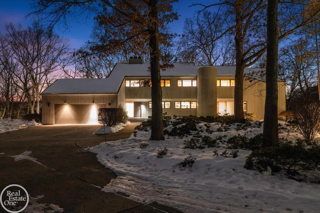 Once in a lifetime location! Custom built contemporary home designed by renowned architect Carl Luckenbach. This custom home is sitting high on a hill overlooking a spectacular 37-acres of rolling majestic forest and the Paint Creek. Property currently consists of 48 acres with the lower 11 acres being dedicated as a nature preserve; Property has potential to have 3-4 additional estate size building sites overlooking this rolling wooded property. There is over 900ft of frontage on the paint creek. The original owner has maintained this home in exceptional condition; features expansive windows in every room that offer views that have to been seen and can't be imagined; Large great room with vaulted ceilings and exposed wood beams; Sunroom with panoramic views opens to large deck leading to stairs that walk down to scenic pond; Large barn with electric-gas-water & 4 horse stalls- fenced pasture & fenced paddock. A distinctive property in the heart of Oakland Township.