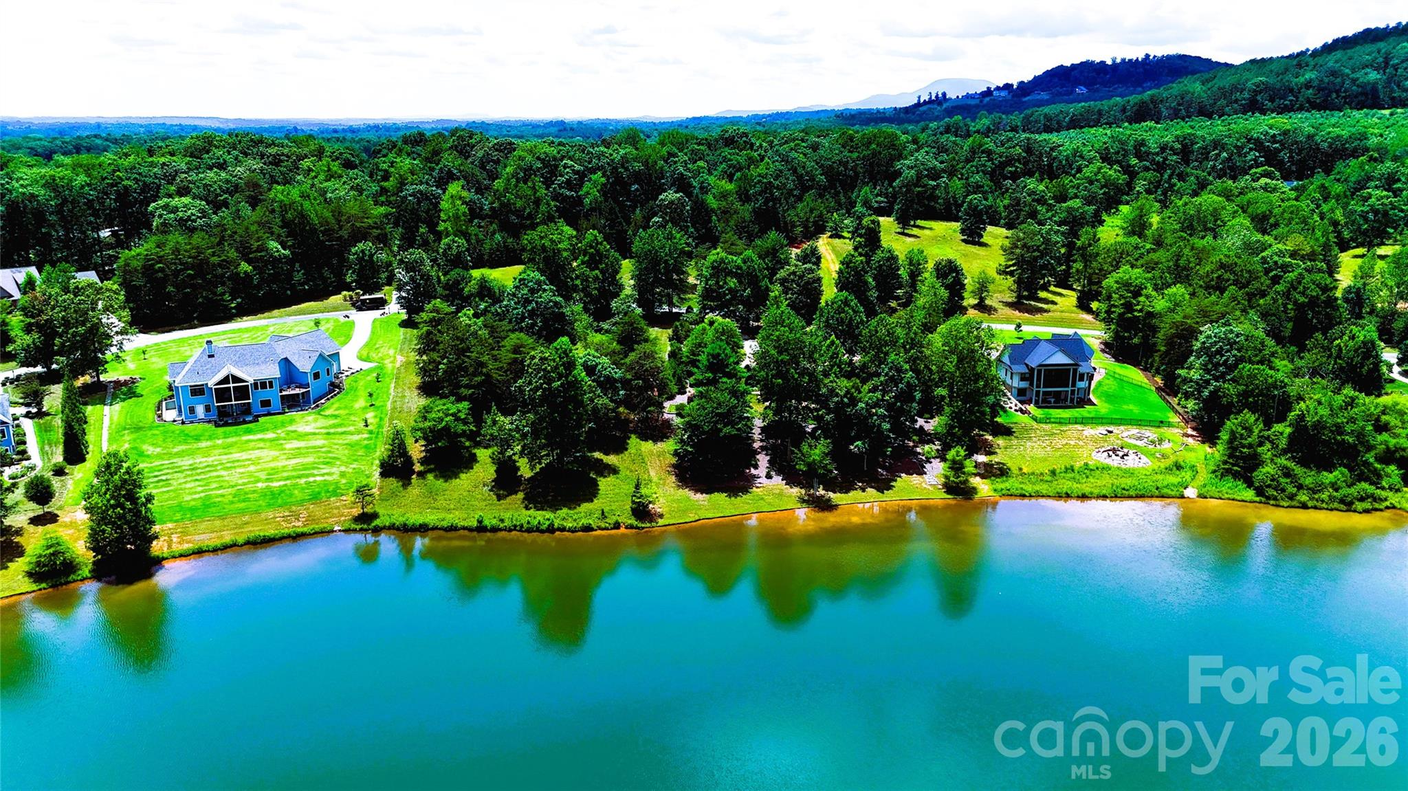 WELCOME TO ONE OF DERBYSHIRE'S PREMIER WATERFRONT HOMESITES ~Featuring: The Lake Estate at Derbyshire - A Signature Waterfront Estate Opportunity in Horse Country!Some places are built - Others are discovered - This is one of the rare few where your vision becomes part of the landscape! Perfectly positioned along the shores of beautiful Lake Sandy Plains within Derbyshire—one of Tryon/Columbus Horse Country's most distinguished gated, equestrian-oriented communities—this remarkable waterfront homesite presents an extraordinary opportunity to create a custom luxury residence where timeless architecture, breathtaking scenery, and an exceptional lifestyle come together in perfect harmony!Whether you're envisioning a full-time residence, an elegant mountain retreat, or a legacy property to be enjoyed for generations, premier waterfront homesites within Derbyshire have become increasingly limited!!! With its peaceful setting, exceptional privacy, and captivating lake views, this property offers an opportunity that is becoming more difficult to find in today's luxury market - if not one of the last ones available! See for yourself!Beyond the shoreline lies an exceptional canvas for your dream home! Expansive lake views framing an unforgettable backdrop! The gently sloping topography is ideally suited for an elegant walkout design, sophisticated main-level living, or a thoughtfully designed custom retreat that seamlessly blends indoor luxury with extraordinary outdoor living! Imagine beginning each morning with coffee overlooking the peaceful waters as the mist rises across the lake. Spend your afternoons kayaking, paddleboarding, canoeing, fishing, or simply enjoying the quiet beauty from your own shoreline. As evening settles in, gather with family and friends beside your resort-style pool, spa, or lakeside fire feature while the Carolina sky reflects across the water. Here, every season offers a new perspective, and every day feels like a retreat! See why many come to call it Home!This Lake Estate offers buyers the flexibility to bring their own builder and architectural vision—or explore professionally designed luxury home concepts thoughtfully created for this homesite with/by the owner/builder. Depending on the selected package, buyers may have the opportunity to personalize floor plans, architectural elevations, luxury finishes, chef-inspired kitchens, expansive covered terraces, walkout lower levels, resort-style pools and spas, outdoor entertaining areas, and countless custom details designed to complement both the homesite and their lifestyle!Life within Derbyshire extends far beyond the homesite itself. Centered around a private spring-fed lake, this exceptional community offers a peaceful blend of refined country living, equestrian heritage with beautifully maintained common areas, scenic walking opportunities, riding amenities, and convenient member access to the renowned CETA/FETA trail systems(*Verify per property). Minutes away, the internationally recognized Tryon International Equestrian Center offers world-class horse shows, training, dining, shopping, entertainment, and year-round events, making this an exceptional destination for equestrian enthusiasts + those seeking an elevated mountain-lake lifestyle!For those searching for more than a site—for those seeking a place where luxury, nature, and lasting memories come together—This Lake Estate at Derbyshire offers an extraordinary opportunity to build not only the home you've imagined, but the lifestyle you've been waiting to live! Conveniently located near Tryon, Columbus, Landrum, I-26, Greenville-Spartanburg Intl Airport, Asheville Regional Airport, and Charlotte Douglas Intl Airport, you'll enjoy the perfect balance of peaceful privacy + everyday convenience!**Separate MLS listing is also available for the lot only, allowing buyers the flexibility to secure this exceptional waterfront homesite today; build whenever the time is right.**