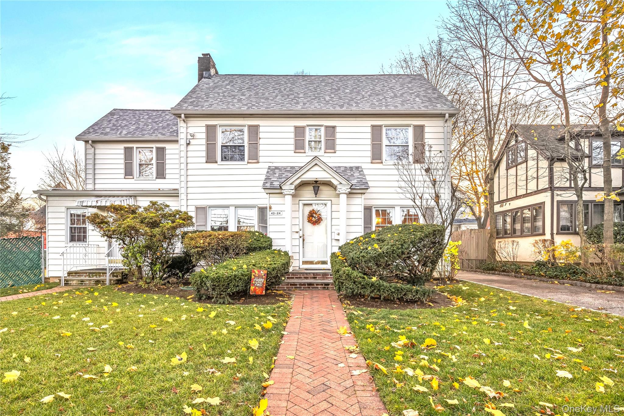 Rare opportunity to own a fully detached colonial with a legal doctor’s office on an oversized 108 x 100 lot (R2A zoning) in prime Little Neck, just off Northern Boulevard. The main residence features a gracious living room with fireplace, formal dining room, eat-in kitchen with breakfast nook, family room, three bedrooms plus an additional flex room, a finished walk-up attic with half bath, and a full finished basement—ideal for a home office, playrooms, guest quarters, a reading room and more. The professional office offers a separate entrance, reception, multiple exam rooms, break room, half bath and a finished lower level with additional exam, records or storage rooms. Enjoy a private, landscaped, fenced yard, patio, and a 2-car garage with attached covered access to the main residence. Exceptional, easily accessible location that delivers the perfect blend of residential privacy and professional convenience.