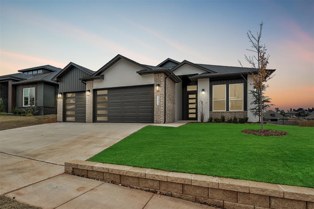 End of year special, $15,000 towards closing costs when partnering with Builder's preferred lender on this home. The perfect blend of contemporary design and timeless traditional elements makes this home the complete package in highly sought-after Rockwell Park. Come experience the quality and craftsmanship of this solid, newly built residence at 7212 NW 154th Street, thoughtfully designed by a builder known for consistent excellence. From the moment you enter  inside, you’ll appreciate the seamless flow of the open-concept living, dining, and kitchen areas—ideal for both everyday living and effortless entertaining. Tile flooring, a long center island, display cabinetry, and under-cabinet lighting elevate the kitchen, while the inviting living room centers around a beautiful fireplace that anchors the space with warmth and style. The spacious primary suite provides a true retreat, offering room to unwind. Its spa-inspired bathroom features a freestanding soaking tub, a tiled walk-in shower, dual vanities, serene color tones, and a walk-in closet complete with built-in cabinetry. A convenient built-in mud bench near the entry keeps the home organized. The thoughtfully designed layout includes four bedrooms and three bathrooms, with the fourth bedroom featuring its own private bath—perfect for guests. Peaceful evenings on the covered back patio overlooking your yard, maintained with a sprinkler system. Highlights include double ovens, a tankless water heater, and wired for a security system, ensuring modern comfort and convenience throughout. Rockwell Park enhances daily life with community amenities such as a neighborhood pool, and playground. Its prime location offers quick access to premier dining, shopping, & entertainment. Located in the desirable Deer Creek School District, this exceptional home combines luxury, practicality, & true ease of living. Linda Plan offers curb appeal & an one-story layout that is perfect for hosting and everyday comfort. Welcome home!