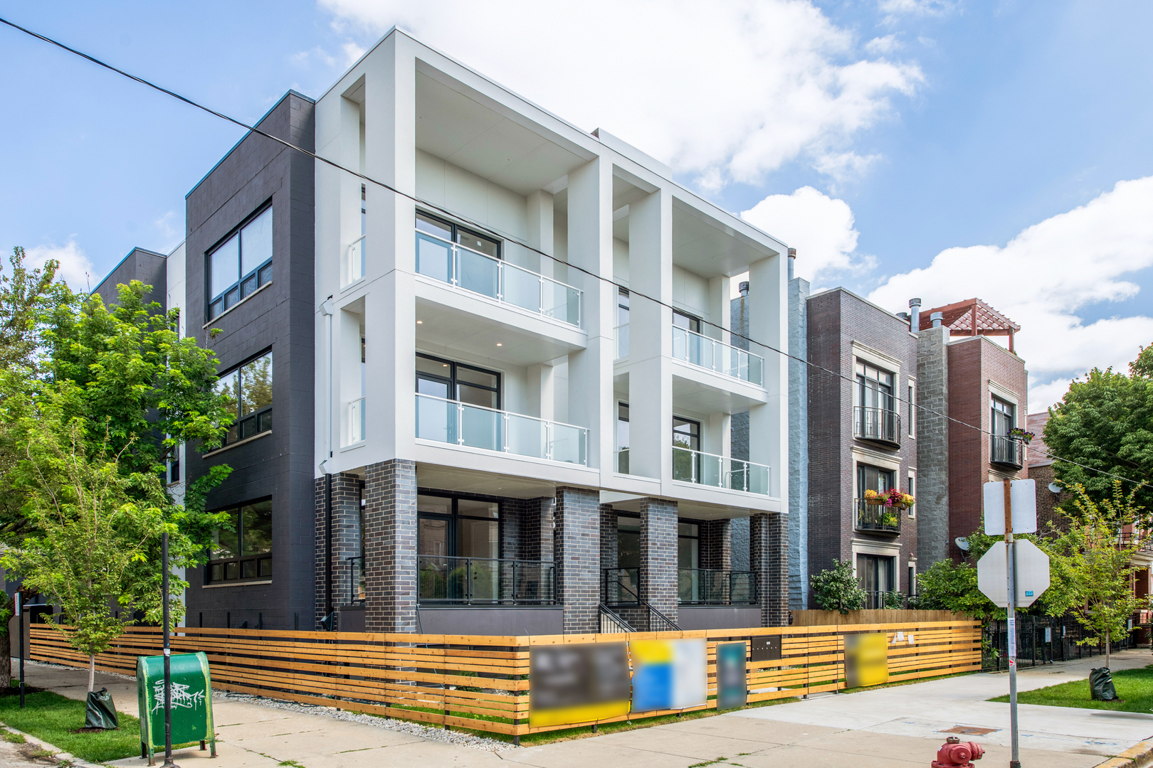 ONLY 3 UNITS LEFT! 50% SOLD BEFORE PRINT. READY FOR OCCUPANCY! Experience modern luxury in this stunning new construction development, perfectly positioned on a south-facing corner lot within an exclusive 6-unit building. This rare corner unit is a true gem, offering exceptional natural light from multiple exposures. Professionally designed PENTHOUSE with top-of-the-line finishes and meticulous attention to detail. This 2 bed/ 2 bath top-floor unit features a stylish chef's kitchen with custom two-toned cabinetry, quartz countertops, a waterfall-edge peninsula, and high-end integrated appliances. The bright, south-facing living room boasts floor-to-ceiling windows and hardwood floors throughout. The spacious primary suite includes a walk-in closet and a spa-like bath with heated floors and designer tiles, while the second bedroom offers a large closet and access to a beautifully appointed second bath with a floating vanity and tub/shower. Enjoy incredible outdoor space with a front balcony and a private rooftop deck showcasing breathtaking city views and Chicago skyline. Includes 1 garage parking space. Please note: photos are from a previously sold unit (2W). The fireplace shown is not included. Unit 3W also features a slightly different living room floor plan and light fixtures.