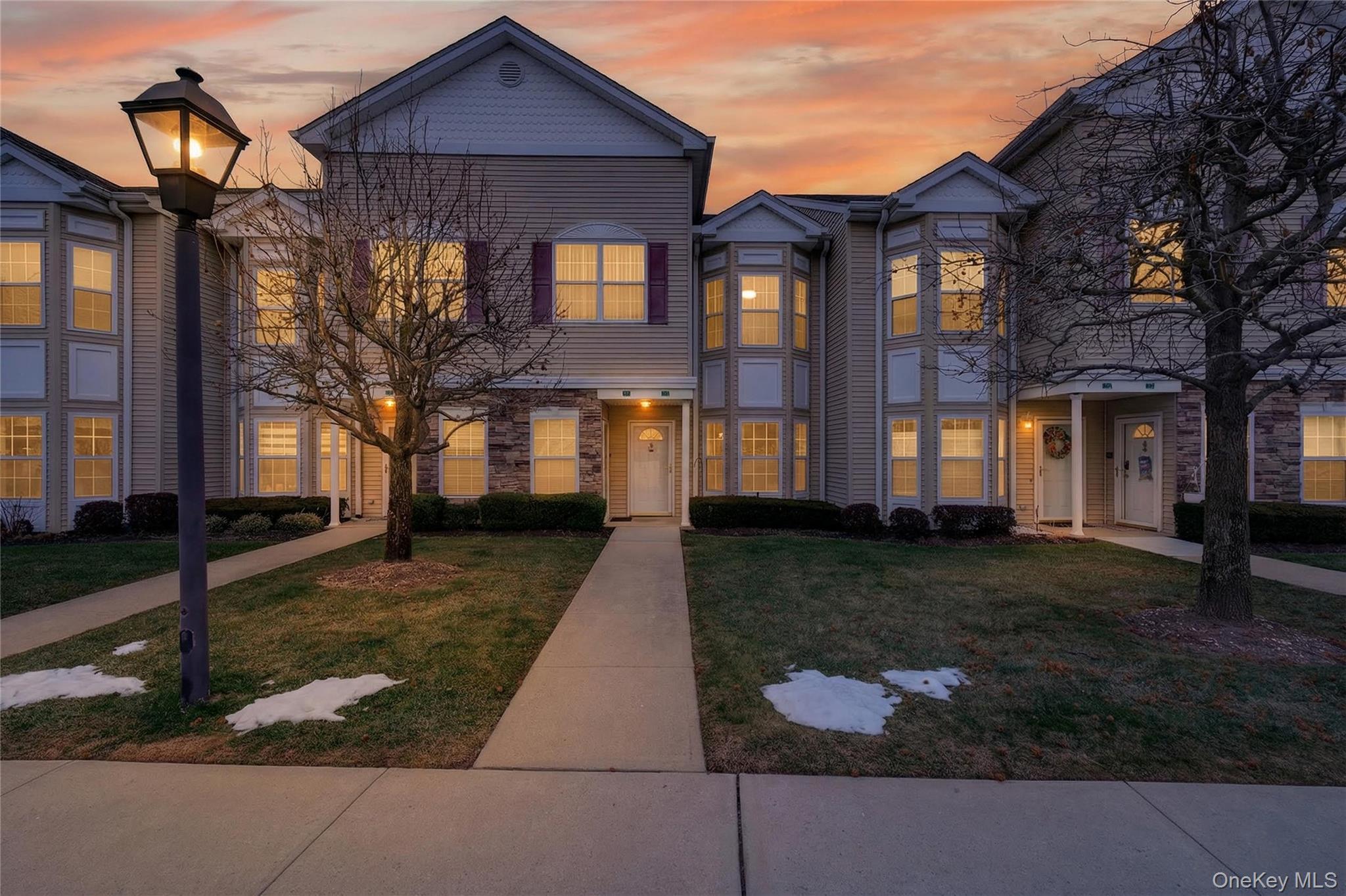 First floor condo living at its finest at The Seasons in East Meadow. This spacious 2 bedroom, 2 bath residence is located in a sought after 55+ community with 24-hour gated security, offering both comfort and peace of mind in a beautifully maintained, landscaped setting.The entire unit has been freshly painted and welcomes you with a bright, open layout designed for easy living. The generous primary suite features an en-suite bath, while the well sized second bedroom is conveniently located near a full hall bathroom. Ample closet space throughout, an in-unit washer and dryer, and a private backyard patio enhance everyday convenience.The finished lower level features brand new flooring and provides versatile bonus space—ideal for a den, home office, or hobby area—along with a walk-in closet, utility room, and additional storage to keep everything organized.Life at The Seasons is more than just a home—it’s a lifestyle. Residents enjoy a clubhouse with heated indoor and outdoor pools, fitness center, game rooms, movie screenings, and a full calendar of social activities. Conveniently located near shopping, parks, and public transportation, this home offers the perfect blend of tranquility and accessibility.