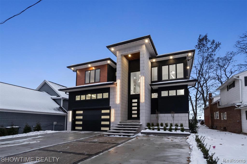 Experience a rare chance to own a brand-new luxury build on all-sports Lake Fenton — Sodded with a sprinkler system and a 5' Crawl space, crafted from the ground up with top-tier finishes. This isn’t your typical new construction; every detail was designed to stand out. As the tallest home on the street, it makes an immediate impression with a custom driveway and limestone entry steps. Inside, the foyer sets the tone with a soaring ceiling and double chandeliers. A custom wine display greets you before the office, and as we enter the living room, a massive Montego porcelain-slab fireplace centers the space while pulling you toward the covered lakeside patio. The kitchen offers a coffee bar, wine bar, Cristallo countertops, and a full Lighted Cristallo island paired with top-tier appliances. A second kitchen with a double convection oven keeps daily cooking simple. The garage was built for car lovers — designed to support a lift holding two additional cars for up to four total, and finished with fresh epoxy and added traction flakes.Upstairs, custom-lit stairs lead to four bedrooms, each with walk-in closets and private full baths. Convenience continues with two laundry rooms — one on the main floor and one upstairs. Two bedrooms, including the primary suite, overlook the lake, and the primary features a walk-out balcony perfect for morning coffee or peaceful summer nights. The primary bathroom and walk-in closet feel like a true retreat, crafted with stunning finishes and the kind of elevated detail that sets this home apart the moment you see it.Opportunities like this almost never hit Lake Fenton — true new construction, modern design, and craftsmanship that’s becoming harder to find each year. This home delivers a level of luxury, quality, and presence that buyers wait a while for. If you’ve been looking for something exceptional, something that genuinely stands out from everything else on the lake, this is your moment. Schedule your private showing today