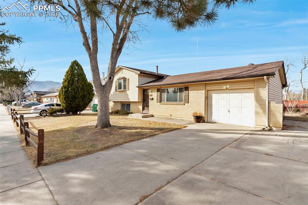 Opportunity knocks in Pikes Peak Park! This 4 bedroom, 2 bathroom home with a 1 car garage is a fantastic estate sale offering incredible value and endless potential. Inside, you’ll find a spacious layout ready for your personal touch. Whether you're looking to update over time or create your dream home immediately, this property provides the perfect clean slate. A functional floor plan makes it ideal for buyers who want to build equity at their own pace. Step outside to enjoy the fully fenced backyard, perfect for pets, gardening, or entertaining. An enclosed patio is attached to the rear of the garage adding a flexible space for hobbies, sun room, or a cozy indoor/outdoor retreat. , this is a rare chance to own in an established neighborhood at an exceptional value. Bring your vision and make it your own!