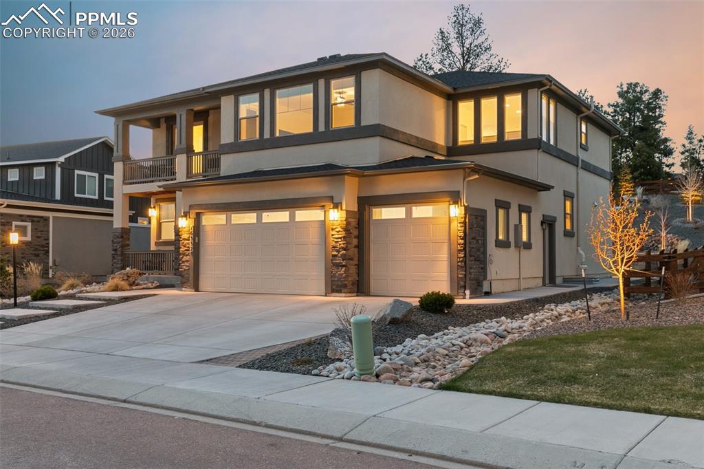Experience elevated Colorado living in this stunning, fully upgraded 5-bedroom, 4-bathroom 3-car garage home on almost a 1/3rd of an acre lot, located in the highly sought-after Sanctuary Pointe community. Showcasing Front Range mountain views and exceptional attention to detail throughout, this home perfectly blends luxury and comfort. Step inside where the main level features a private office with elegant French doors and a sophisticated living room anchored by a dramatic floor-to-ceiling tiled fireplace—perfect for cozy Colorado evenings. The gourmet kitchen is a chef's dream with sleek and timeless finishes complete with double ovens, a gas cooktop, quartz countertops and an expansive island. Outside find your own private retreat, where multiple outdoor living spaces—including a covered patio—invite you to relax while enjoying tranquil water features and sweeping mountain views. The main level also offers a dining area, walk-in pantry, powder room, and a functional mudroom with direct access to the garage. Upstairs, you’ll find a versatile loft with walkout access to a view deck, two secondary bedrooms, and a laundry room w/ built-in cabinetry, and a utility sink. The luxurious primary suite is a true sanctuary, boasting a private deck, a large walk-in closet, and a spa-inspired 5-piece bath with a freestanding soaking tub, dual vanities, tiled shower with penny tile accents, as well as a linen closet. The finished basement offers 9-foot ceilings, built-in speakers, a striking stone fireplace, a full wet bar and two additional bedrooms. Additional upgrades include dual A/C units, dual furnaces, a radon mitigation system, hand troweled texture walls, whole-house ventilation and drip irrigation. Ideally situated with easy access to I-25, this home offers a convenient commute to both Denver and Colorado Springs, within minutes from scenic trails, hiking, dining, shopping, and the Air Force Academy. This is Colorado living at its finest—schedule your showing today.