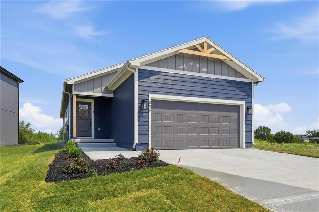 Welcome to THE most attainably priced NEW home in one of the best resort-style golf and lake communities!  This beautifully designed 2-bedroom, 2-bath ranch home offers superior energy efficiency, smart use of every square foot, and modern, low-maintenance living. Step inside to an open-concept layout that’s perfect for entertaining or relaxing in style. The living area flows effortlessly into the kitchen and dining space, where a large double-door pantry provides plenty of storage. Natural light floods every room, creating a warm and inviting atmosphere. The private primary suite is tucked away from the second bedroom for ultimate comfort, complete with a walk-in closet and ensuite bath. But don't forget to make time for down time lounging on the covered patio too. This home is equipped with energy-efficient lighting, high efficiency HVAC and water heater, Low-E windows with blinds, soft-close cabinetry, fully insulated garage, and basement finish opportunity to add another 751 square feet!   Eastbrooke at Creekmoor has it all! Designed around 108 acre Lake Creekmoor and the acclaimed 18 Hole Championship Golf Course, Creekmoor offers one of the most comprehensive amenities packages available, where homeowners with both active and relaxed lifestyles enjoy what feels like vacation all year long. Pools, tennis, pickleball, basketball, 24-hour fitness center, golf pro shop, Tavern on the Moor restaurant and bar, fishing, boating, SUP, and still more...it's ALL here! With an abundance of shops, restaurants and services minutes away and with easy access to Jackson and Johnson Counties, homeowners have all the benefits of metro living at their fingertips while enjoying home life outside the hustle and bustle. Whether making your first home purchase or your last, this is a destination community like no other.
