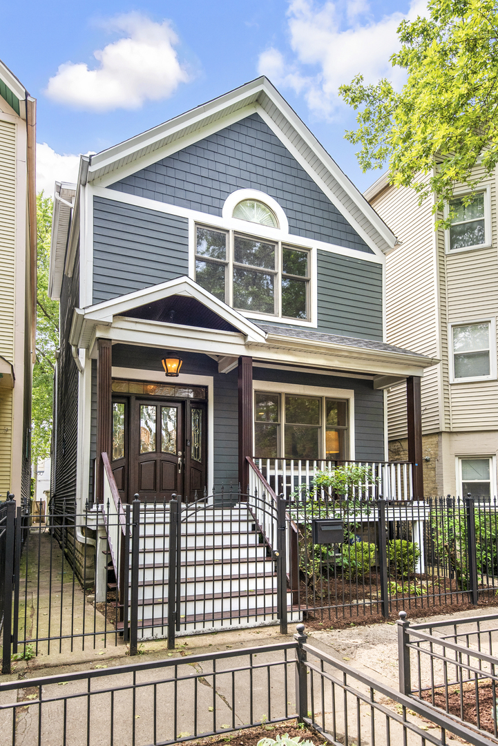 Welcome to your dream home located in the heart of vibrant Lakeview! This impressive single-family residence offers an expansive 2,600 square feet of living space, expertly designed to accommodate both comfort and luxury. With 6 spacious bedrooms and 3.5 well-appointed bathrooms, this home is ideal for those seeking ample space.    Step inside to discover gleaming hardwood floors, accentuated by natural light streaming through stunning skylights. The gourmet kitchen is a chef's delight, featuring stainless steel appliances, an island with extra seating and loads of storage.    The living and dining areas are graced with an elegant dual sided fireplace, perfect for relaxing evenings. The second level features 3 bedrooms including a primary suite with dual walk in closets and private bath. The third level contains a 4th bedroom or office with access to a private rooftop terrace. For further versatility, the lower level features 2 additional bedrooms, a full bath, laundry, storage, a recreation room and newer carpet throughout.    The fenced in yards, new rear deck and new front porch enhance the home's exterior charm. Modern comforts are ensured with newer furnace (2024), newer hot water heater (2024), newer kitchen roof (2024) and newer skylights (2024). This home seamlessly blends function and style, making it a true urban oasis.