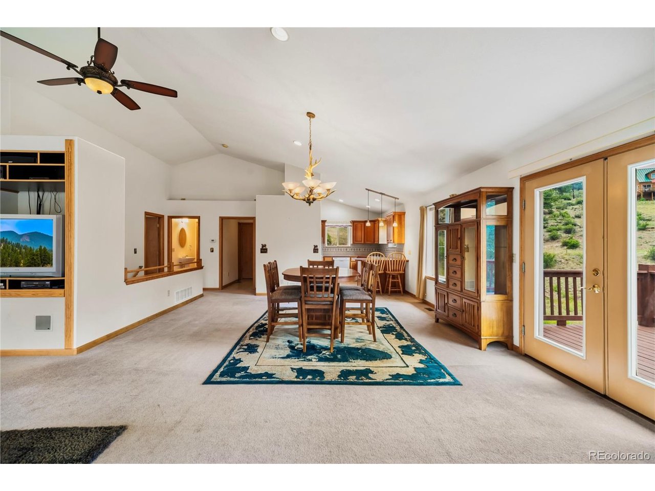 Welcome to a spacious mountain retreat in the charming, historic town of Shawnee, Colorado, just minutes from Bailey and Highway 285. Set in a peaceful Rocky Mountain setting with no HOA, this well-maintained full time or second home offers generous living space, a large grassed yard, hammock trees, and the privacy and flexibility buyers seek in a true Colorado mountain property. The home offers room to spread out with bright, comfortable living areas on both levels. The upper level features an inviting, main living and dining space and a spacious, well-equipped kitchen with access to the covered front porch and back deck. The lower level includes two bedrooms, a large living area, and two additional rooms ideal for storage, office space, hobbies, or flexible use. Enjoy a large grassy yard surrounded by trees, outdoor space for relaxing or entertaining. The attached two-car garage enters directly into the main living area, making everyday access easy and convenient, especially for bringing in groceries and gear. This property offers quick access to Highway 285, exceptional area schools, National Forest land just up the hill, and the outdoor recreation that defines the Rocky Mountains. The stunning views and mountain charm make this an ideal location. With an easy route from the Metro Denver area and a setting in the heart of Colorado's mountain lifestyle, this home is well suited for a larger household, second-home use, or anyone seeking space, privacy, and year-round mountain enjoyment.