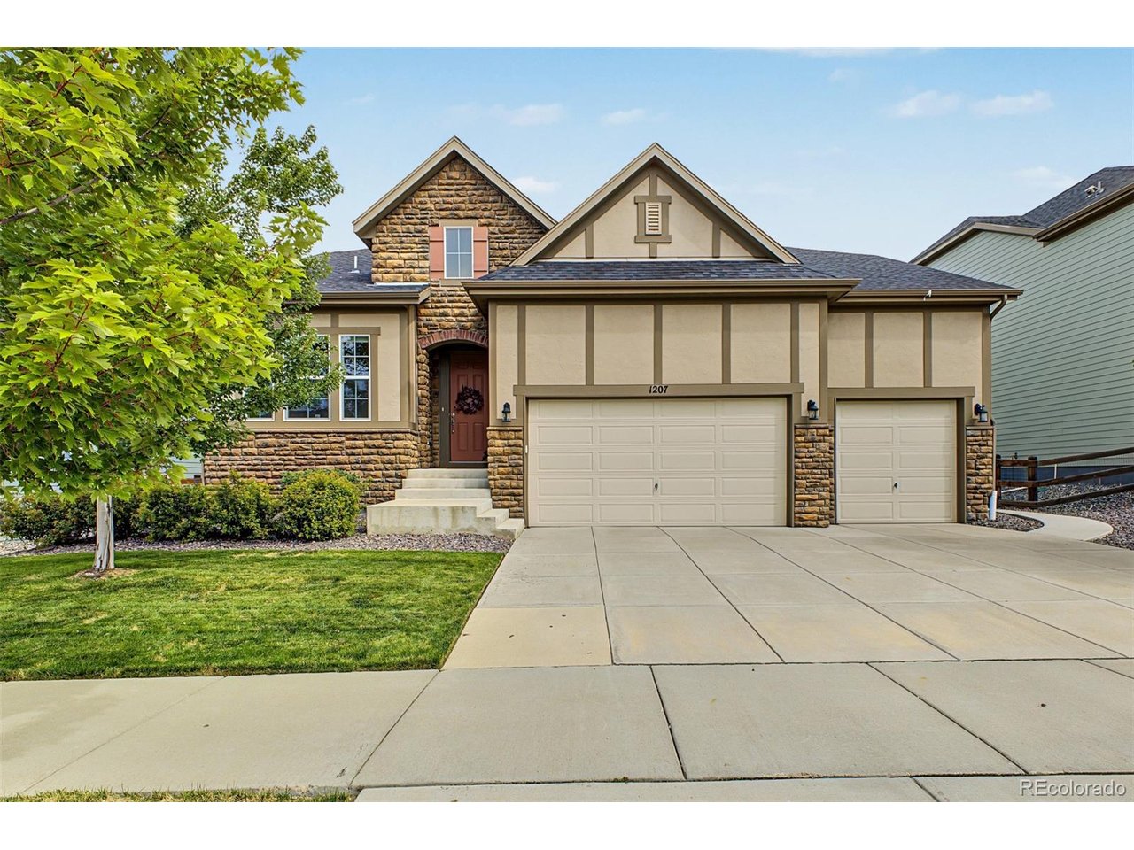 Welcome to this beautifully designed ranch home offering spacious main-level living, impressive finishes, and an open layout filled with natural light. The great room makes an immediate statement with soaring 13-foot ceilings, expansive windows, and a dramatic floor-to-ceiling stone fireplace. The space flows seamlessly into the kitchen, featuring a large quartz island, white cabinetry, double ovens, a gas cooktop, and plenty of room to gather and entertain. Engineered hardwood flooring extends throughout much of the main level, complemented by quartz countertops, contemporary finishes, and a light, neutral color palette. The primary suite offers a private retreat with a spacious walk-in shower featuring dual shower heads, separate vanities, and a generous walk-in closet. Two additional bedrooms share a convenient Jack-and-Jill bathroom, with an additional bedroom great for guest or a home office. Step outside to the covered patio for additional living and entertaining space. A 3-car garage provides plenty of room for vehicles and storage, while the full unfinished basement offers incredible potential for future bedrooms, recreation space, a home gym, or additional living areas. Ideally located with easy access to Erie, Lafayette, and Louisville, this home is within the Boulder Valley School District and just a short walk from neighborhood parks and Meadowlark School. A fantastic combination of location, space, and single-level living. *Below market rates available!