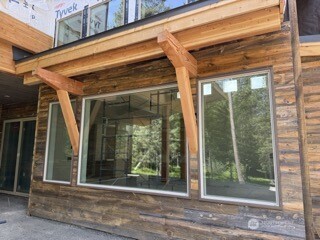Image is of a Suncadia home being built, similar siding and stone for reference.