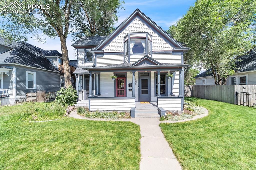 This early 1900's Victorian offers cozy sunrooms, 10-foot ceilings, unique little nooks as well as convenient upgrades. And the Switchbacks Coffee Shop shop is just a few steps away! The original hardwood floors throughout, the heated floor in the main-level bathroom, and the updated kitchen with luxury vinyl flooring blends old with new in the best way. The main home provides ample closets and storage, and every room is filled with warmth and light from ample windows throughout. Step outside to the back yard, and you'll find a custom gas fireplace surrounded by hand-made wooden seats. The apartment above the separate garage, has a it's own entrance, is fully furnished, and is currently used as a successful vacation rental, offering an opportunity for income or multigenerational living. Washer and dryer are included in both the home and the apartment for added convenience. The garage has a workshop with 220 power, ideal for hobbies, projects, or extra storage. All apartment furnishings can be sold separately, making this flexible space move-in ready or customizable to your needs. Zoned heating and cooling with 3 seperate mini-splits, and separate furnaces for each floor, ensures personalized comfort. With timeless details and modern touches, this property offers charm, space, and potential all in one.