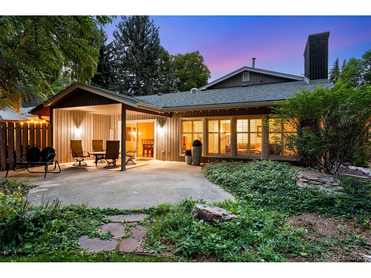 Idyllic lock and leave, Impeccably Remodeled Corner Residence "Paired" home, in a Gorgeous park-like setting, every surface, every system = polished to perfection & backing to community open space w/ the landscaped Sherwood lateral in front and Williams Lake views to the south! 1115 Parkwood has been completely transformed with sophisticated finishes, In the desirable Parkwood community, convenient location just down from UC Health, Woodward & Scotch Pines Shopping Center off Drake & Lemay in mid-town Fort Collins! Generous outdoor living space - oversized covered back patio & lush garden area, walkway & gated covered front porch/courtyard. 2019 Class IV roof & 2024 newer 5" gutters, fresh exterior paint, Recreational lake rights on Williams Lake/non-motorized. Spacious 2 Bedrooms/suites/2 Baths + excellent in-home office space (built-ins) + 2 common living areas/flex-space, finished 2 car garage w/ Wifi opener, at nearly 2,000 finished SQFT! Split Bedroom layout - each w/ their own bathroom & both w/ stunning finishes! Check out this Spa-Inspired 5 piece primary bathroom remodeled by Kitchen & Bath Design Center, w/ heated floors, Alder cabinetry, soothing oversized soaker tub, the perfect Oasis after a long day! Quartz countertops, oversized shower w/ cool down seat/frameless door & poured pan/tiled floor. Gorgeous Handscraped Acacia hardwood floors, Plantation Shutters, Newer AC & Furnace 2022, whole home humidifier! Brick Gas F/P insert in 2021, flanked with Shinnoki wood cabs & shelves, 2017 50 gal. H2O heater, stackable 2026 LG W/D incl., new Milgard oversized slider & Bdrm windows, Graber blinds, Excellent storage & functionality in this stunning modern kitchen, Shinnoki cabinetry w/ inlays, pretty green glass splash w/ Quartz Countertops, Stainless appliances & under cab lighting & breakfast bar. Upper rails match the inlays in the kitchen cabinetry! Recent low radon test & pull down extra storage above garage! Charming & Practical low-maintenance living!