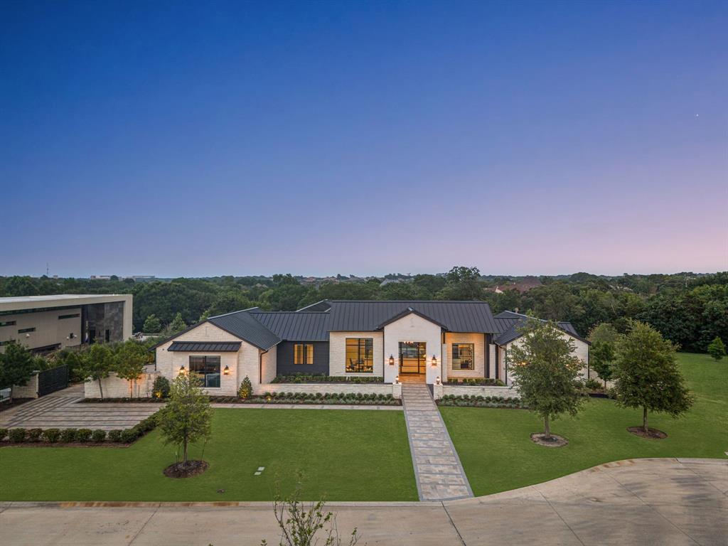 Welcome to an extraordinary 6 bedroom, 6.1-bath residence in the guarded and gated Quail Hollow community of Westlake, set on an acre of beautifully landscaped grounds with an exceptional collection of indoor and outdoor amenities.The stunning great room showcases dramatic beamed ceiling details, a sleek linear fireplace, expansive sliding doors, and seamless views of the outdoor living spaces. The chef’s kitchen is beautifully appointed with Sub-Zero and Wolf appliances, an oversized quartzite island, walk-in pantry, and a fully equipped prep kitchen featuring an additional refrigerator, microwave, Miele coffee maker, warming drawer, and dishwasher. Designed for both everyday living and effortless entertaining, the main level offers three bedrooms, a private office, game room, media room, and stylish bar. Downstairs, you’ll find three additional bedrooms, another game room, and a dedicated exercise room.The luxurious primary suite is a true retreat, featuring designer wallpaper, beautiful hardwood floors, a spa-inspired bath with his-and-her vanities, soaking tub, steam shower, and separate his-and-her oversized closets.Outside, the property becomes your own private resort. Enjoy a large pool and spa, fire pit, oversized covered outdoor living area with Phantom screens, expansive yard, and private pickleball court—all surrounded by the privacy and ample yard. With hardwood floors throughout, exceptional craftsmanship, thoughtful design, and an incredible array of amenities, this home offers the ultimate Westlake lifestyle in one of the area’s most coveted guarded and gated communities.