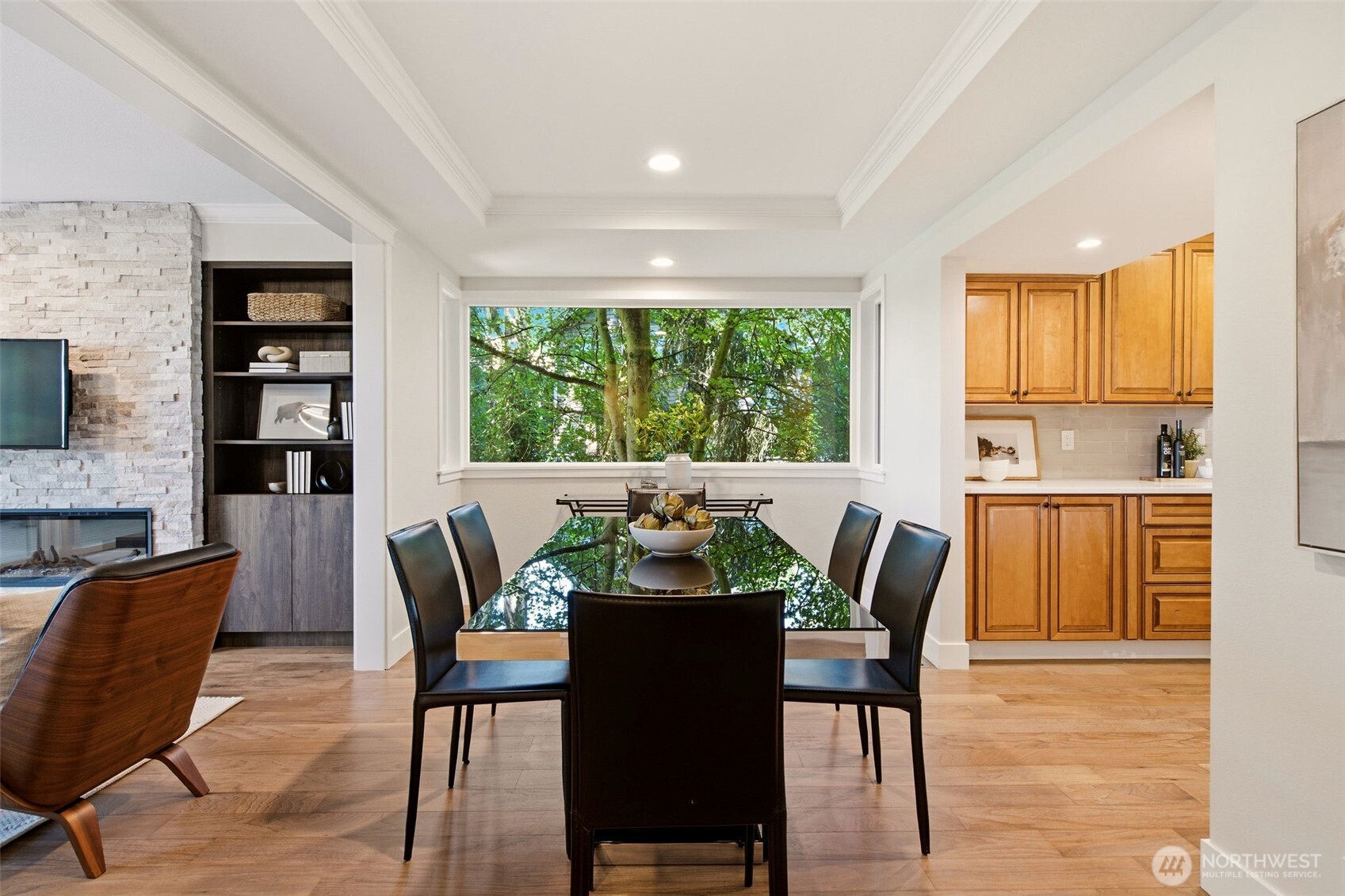 Open-concept layout connecting dining, kitchen, and family room.