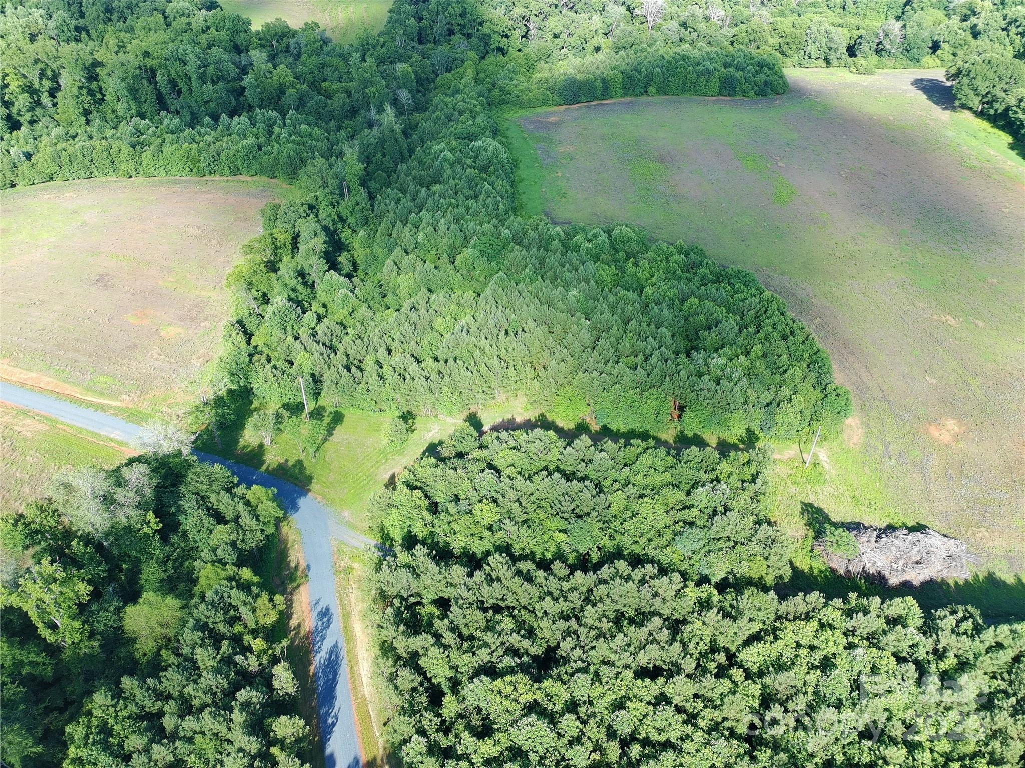 Woodridge Farm Estates is a beautiful 66 acres being subdivided into 5 estate size parcels appropriate for horse/hobby farm, private residential estate, a place for your dogs to play, grow some crops, plant some fruit trees, or play in the creek on lots 2-5.  Land is level to gently rolling. Each lot has some trees and some cleared land. Survey and 4 bedroom septic permit completed. A 30' shared private road to be named Woodridge Farms Dr is being created to include a road maintenance agreement.  Minor restrictions only meant to create and maintain a private, estate community.Crops on field at time of closing will convey to the farmer.Owner of property behind the community has an easement for ingress and egress. Tax Value to be determined.