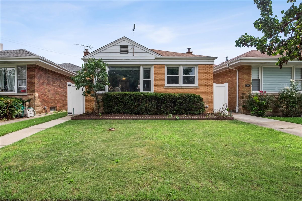 Beautifully truly one of a kind remodeled move in ready unique split tri level home. This updated 4 bedrooms 3 full baths with highest finishes and best craftsmanship in quiet Peterson Park. Tons of natural light on the main level. Quality throughout with open concept, coved molding, recessed lighting, and beautiful hardwood floors. Open concept main floor with kitchen island, stainless steel appliances, and elegant fixtures. New vinyl fence on both sides to enjoy privacy while relaxing on the paver patio. There is a 2 car detached garage. So many wonderful features to list. Each level of this home will make you think you are in a separate residence. Schedule your showing to see first hand how big and stunning this property truly is.  THE HOME IS MUCH BIGGER THEN IT SEEMS.