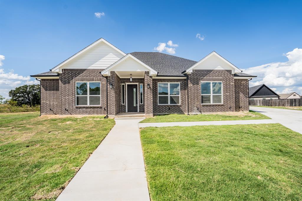 Sophisticated 2025-built home in Stone Briar Subdivision offers 4 bedrooms, 4 full bathrooms, and an office (or 5th bedroom) on a cul-de-sac with pasture views from the backyard! With 2,876 square feet and a magnificent floor plan, you'll step into the foyer with an office with a closet to the right. Tall ceilings and an abundance of windows compliment the great room. In the eat-in kitchen, the family cook will enjoy the sleek granite countertops, granite waterfall island, stainless steel appliances, and walk-in pantry. Retreat to the owner's primary ensuite bedroom, with trey ceiling and recessed lights, where you can relax in the elegant bathroom that comes with granite countertops, soaking tub, double sink, vanity area, walk-in shower with glass wall, and a walk-in closet with custom shelving. One guest bedroom includes a walk-in closet and a full hall bathroom. Two additional guest bedrooms are split from the primary bedroom and each bedroom has its own ensuite full bathroom with granite countertops and walk-in showers. A separate laundry room with granite countertops is near the 2-car garage. Luxury vinyl plank flooring provides a refined look throughout all the living and bedroom areas, along with recessed lights brightening up the living, dining, and kitchen. Outside, sit on the covered back porch with panoramic views of the neighboring land. You'll find this house at the end of a quiet street with sod grass already established. Move-in ready, be the first to appreciate the thoughtful floorpan and location of this new construction build!