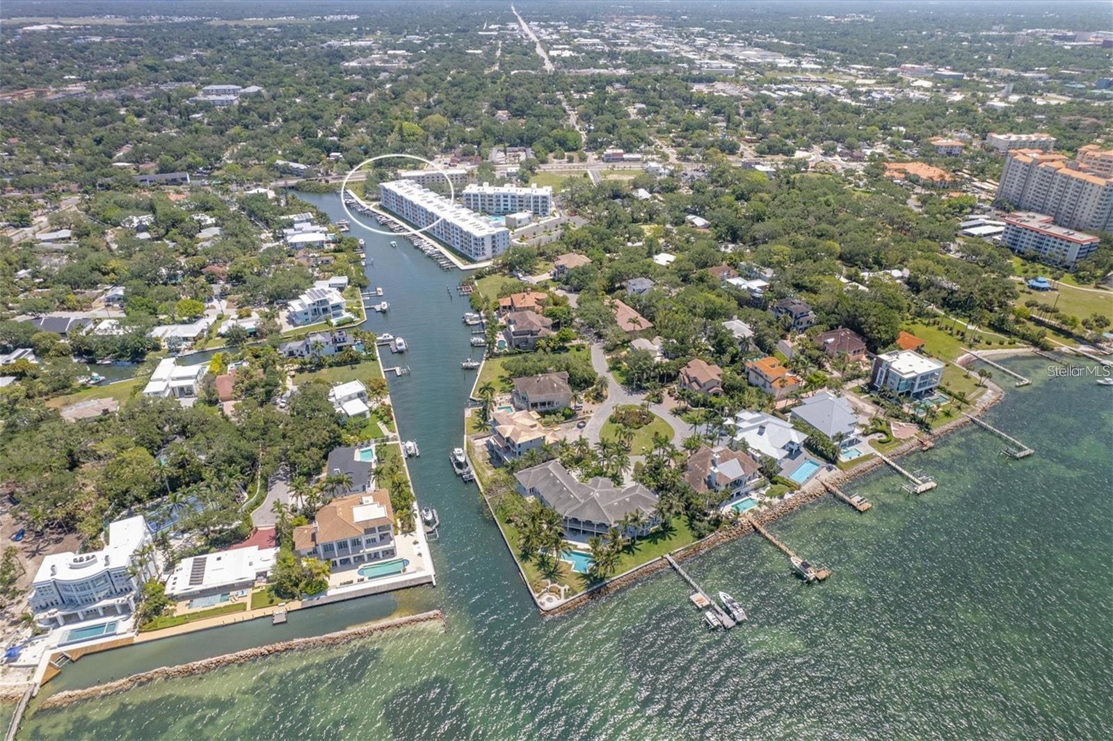 MUST SEE PENTHOUSE AT THE STRAND, WEST OF TRAIL, NEW IN 2022 & IN A GATED COMMUNITY. ON-SITE MANAGEMENT AND MAINTENANCE. PRIME LOCATION ONLY ONE MILE TO DOWNTOWN SARASOTA, PALM AVENUE FOR SHOPPING, RESTAURANTS AND THE ART CULTURE/THEATRES. 15 MINUTES TO BEAUTIFUL ST. ARMAND'S AND LIDO KEY BEACH. 5 MINUTES TO SRQ AIRPORT AND 15 MINUTES TO FAMOUS UTC MALL. OPEN FLOOR PLAN MAKES THE UNIT SPACIOUS AND COMFORTABLE. THE MASTER BEDROOM HAS AN ENSUITE BATH WITH LAUNDRY ROOM. BEAUTIFUL WALK-IN SHOWER AND VANITY WITH DUAL SINKS. WALK IN CLOSET FOR YOUR PERSONAL BEACH WEAR. THE DEN CAN FIT A QUEEN BED FOR A SECOND BEDROOM PERFECT FOR YOUR FRIENDS AND FAMILY TO VISIT AND 2ND FULL BATH WITH TUB AND SHOWER. THE KITCHEN FEATURES A REVERSE OSMOSIS FILTER WATER FAUCET AND HARD SURFACE COUNTERS, STAINLESS STEEL APPLIANCES AND A LARGE ISLAND FOR ENTERTAINING AND ANOTHER WRAP AROUND COUNTER FOR YOUR CHEF'S DINNER. 9 FT HIGH CEILING AND SLIDERS MAKE THIS UNIT BRIGHT WITH NATURAL LIGHT. GORGEOUS VIEWS & SUNSETS FROM THE BALCONY. RELAX AND ENJOY THE BOATS, BIRDS, FISH, & DOLPHINS/MANATEES. SIT ON THE DOCK AS IT'S A FISHERMANS DELIGHT. DIRECT WATER FRONTAGE ON WHITAKER BAYOU AND DIRECT ACCESS TO SARASOTA BAY AND INTRACOASTAL WATERWAY. THE AMENITES ARE ENDLESS WITH THE AMAZING HEATED POOL/SPA, GRILLING CENTER AND TOP OF THE LINE FITNESS CENTER. DEEDED GARAGE PARKING SPACE UNDER BUILDING WITH PLENTY OF OPEN GUEST PARKING.  WATERFRONT WALKING PATH, FLOATING KAYAK AND PADDLE BOARD DOCK. PET FRIENDLY WITH A FENCED-IN DOG PARK. GREAT RENTAL OPPORTUNITY WITH ONLY A MINIMUM OF 7 DAYS. WHERE IN SARASOTA, ON THE WATER, CAN YOU FIND ALL THIS FOR $625,000? RESIDENTS ARE WARM AND FRIENDLY AND THE INDIAN BEACH SAPPHIRE SHORES, ACROSS THE WATER, IS A GREAT WALKING NEIGHBORHOOD FOR MORNING AND EVENING STROLLS.
