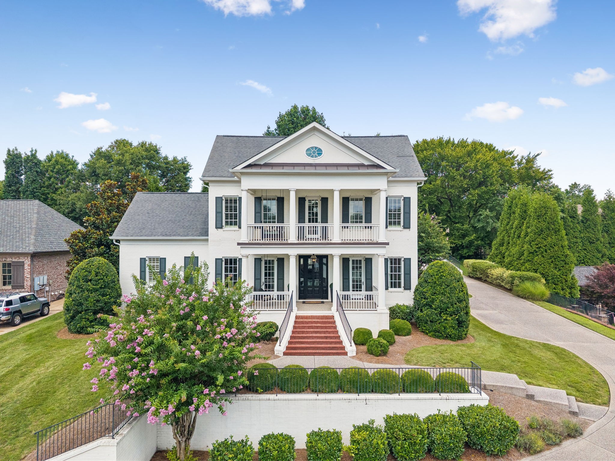 Live the dream in this southern, classic home custom designed by Brandon Jenkins of Grove Park* This home features quality millwork, architectural details found only in the best properties*Welcome to the gated community of The Governors Club* Positioned quietly on a cul-de-sac, this beauty grants views for days looking out from the double front porches* Open the doors to outdoor living and entertainment spaces from front to back* Updated to perfection* Restoration Hardware lighting added, designer wallpaper, new powder room and upstairs bath, deems this home move-in-ready*The primary suite offers privacy and peace on the main level, with three, ensuite bedrooms on second floor* 10 ft. ceilings downstairs as well as upstairs bring grandeur to the interiors*The kitchen boasts of natural light with the living area opening wide to provide ample gathering space* Take a private, second staircase to the theater room, wet bar, bonus room* Drop zone by main level garage provides space your second frig adjacent to kitchen. Don't miss kitchen's hidden pantry and two walk-in unfinished storage rooms upstairs*Thanks for your interest in this lovely home*