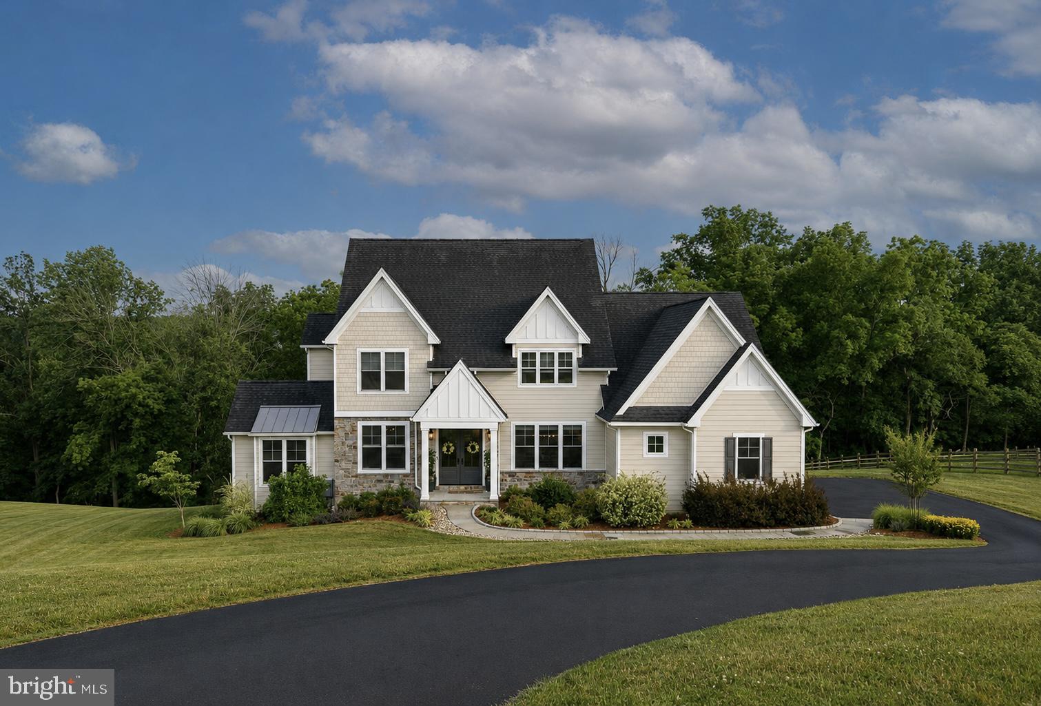 Welcome to 18 Popjoy Lane, an exceptional 4-bedroom, 4.5-bath residence nestled in the highly sought-after Marsh Lea community and award-winning Downingtown East School District. A rare opportunity to enjoy a premium lot with picturesque views of Marsh Creek Lake, the convenience of direct access to the lake and the Marsh Creek Trail system, and all the luxuries of new construction with lux finishes, thoughtful design, and outstanding indoor-outdoor living. A grand entrance begins with impressive 8-foot double front doors, opening to a stunning interior featuring premium hardwood flooring throughout the main level, upgraded 8-foot doorways, and custom millwork throughout. The foyer is flanked by an elegant formal dining room and a spacious living room or 2nd private office, creating the perfect setting for both everyday living and entertaining. At the heart of the home, the sun-filled family room is anchored by a gas fireplace and seamlessly connects to the beautifully appointed gourmet kitchen. The kitchen boasts upgraded stainless steel appliances, including a chef’s 6 burner Thermadore gas stove, Bosch dishwasher, built in microwave, and double ovens, premium honed Carrara marble countertops, abundant cabinetry, and a butler's pantry complete with additional refrigeration and matching Carrara marble surfaces.Just off the kitchen, enjoy effortless indoor-outdoor living with access to the screened-in porch and expansive deck, ideal for taking in your picturesque Marsh Creek Lake views. A well-designed mudroom offers additional storage and a covered side entrance, while a powder room completes the main level.Upstairs, the spacious primary suite serves as a private retreat, featuring a beautiful custom picture window, a generous walk-in closet, and a luxurious en-suite bath with dual Carrara marble vanities, a soaking tub, and a walk-in shower. A princess suite with a private bath, along with two additional generously sized bedrooms connected by a Jack-and-Jill bathroom, provide ample space for family and guests. Tucked away off the staircase landing, an additional private office with vaulted ceiling offers the perfect work-from-home setup. The finished walk-out basement provides endless possibilities for recreation, fitness, or entertaining and includes a full bathroom. Step outside to the lower patio and unwind in the hot tub while enjoying the privacy and scenic surroundings of the backyard. Additional highlights include premium landscaping and hardscaping, oversized 8-foot garage doors, and a highly desirable lot offering both privacy and breathtaking lake views, plus direct lake access as well as convenient neighborhood access to the Marsh Creek Trail system. Conveniently located near Marsh Creek State Park, Eagleview Town Center, shopping, dining, and major commuter routes, this remarkable property offers the perfect combination of luxury, comfort, and location. Don't miss the opportunity to make 18 Popjoy Lane your next home. Schedule your private showing today.