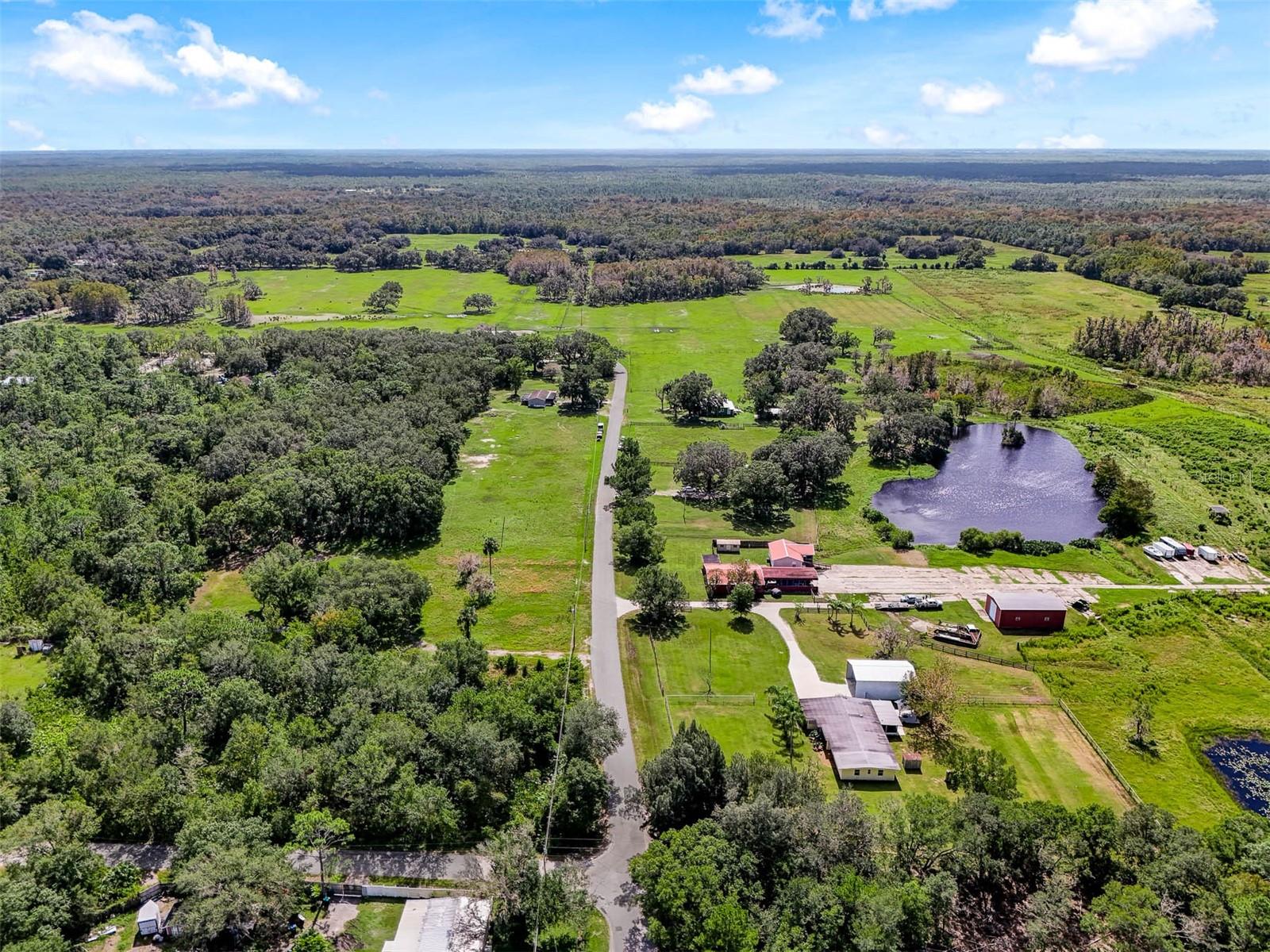 Over 100 acres in the heart of East Orlando and currently the last operating cattle ranch in Orange County! The possibilities for this property areendless with the working ranch operating on 20 parcels combined with the opportunity to live in or rent out multiple homes. Zoned A-2 and R-1these parcels allow you to live outside the constraints of an HOA while still being close to every convenience with a variety of uses. Sitting justSouth of SR 50 you are only minutes away from shopping and dining with easy access to Downtown Orlando, Waterford Lakes, or head East toenjoy local beaches. This sprawling acreage features 5 homes, 2 of which are currently leased out, 2 barns and 2 lakes! Also noteworthy and afun fact: there is a Chuck working on property that has been with the farm for 40+ years and the beautiful Victorian home is 150 years old.Approximately 50 full size cows call this farm home with another 8 to 10 calves (cows can be sold at market “on the hoof price” based on goingrate at the time of sale, otherwise they do not convey). Floor plans, Matterport and additional info available. Call today to schedule a tour andexplore the never ending opportunity that is 5th Street in 32833!