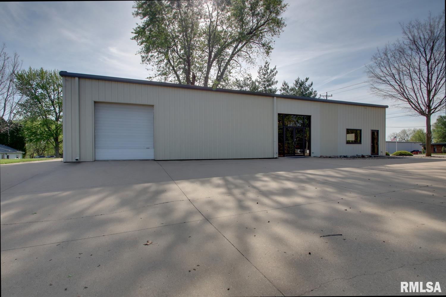 Flexible 2,500 sq ft commercial building available for lease. Formerly home to a monument business, the property offers a versatile mix of reception/showroom space, private office area, and a large open shop/warehouse with oversized overhead doors and abundant paved parking. The 572 sq ft 2-car garage is also included with the lease offering additional storage or operations space. Positioned on busy Locust St near a great mix of businesses including retail, dining, and manufacturing. 5,800 cars pass by daily. Come check out this great space for your business!