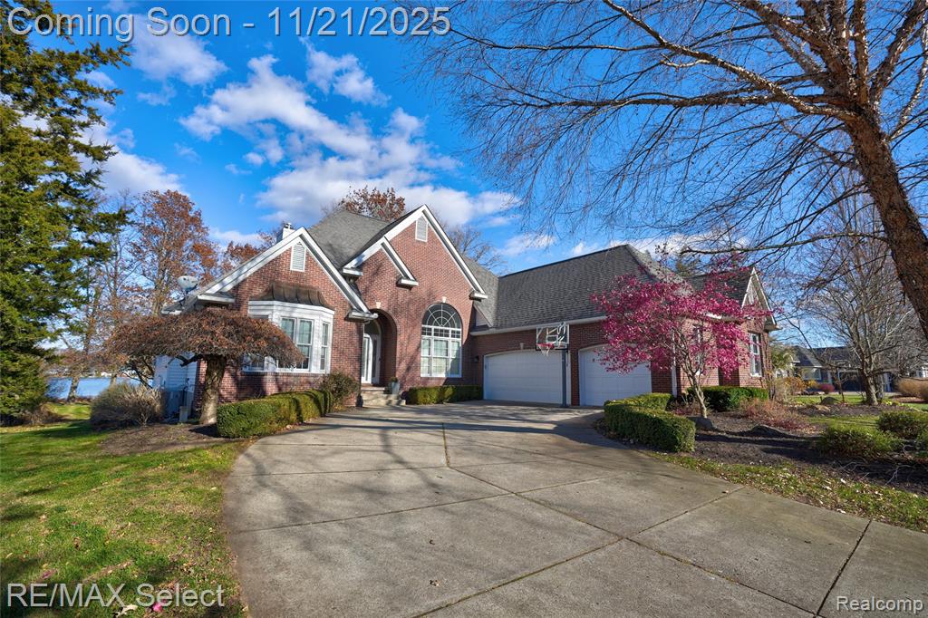 This exceptional home truly checks every box! Thoughtfully custom-built, it is perfectly positioned on .86 acres with 75 feet of pristine frontage along All-Sports Loon Lake. The gourmet kitchen showcases stainless steel appliances, an expansive eat-in island, and abundant custom storage, while the lakeside breakfast nook provides a serene setting to start your day.The firelit primary suite is a true retreat, featuring a spa-inspired bath with a beautifully tiled shower, indulgent soaking tub, and a generous walk-in closet. Two additional first-floor bedrooms and a sophisticated den/office with built-in bookshelves offer both comfort and elegance.The walkout lower level elevates the home’s livability with a second full kitchen, an impressive rec/family room, a fourth bedroom, full bath, and a dedicated space ideal for a private gym or executive office. Outdoor living is equally luxurious—an expansive deck and patio capture sweeping lake views, while the brick paver firepit at the water’s edge sets the perfect stage for memorable evenings. Dock, boat hoist, and jet ski lift are all included. Ideally located near Spring Meadows Country Club, this home caters beautifully to the golf enthusiast seeking a premier lifestyle.