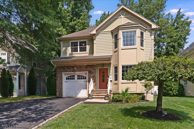 Beautiful, newer four bedroom colonial, where timeless style meets modern comfort in a highly convenient location just minutes from town. Offering a spacious and thoughtfully designed floor plan, this home is perfectly suited for both everyday living and entertaining. The sun filled living room flows seamlessly into the formal dining room, while the open-concept kitchen features granite countertops, stainless steel appliances, including a new Bosch dishwasher, and is open to the inviting family room with a cozy gas fireplace. A convenient powder room and mudroom with direct entry to the one car attached garage, complete with an EV charger, round out the main level. Upstairs, the generous primary suite offers a relaxing retreat with a large walk in closet and spa like bath featuring a jetted tub and glass-enclosed stall shower. Three addy'l bedrooms and another full bath complete the second floor (w/pull down attic). The fully finished, tiled bsmt adds even more versatile living space with a large rec room, exercise room or home office, an addt'l full bath, and plenty of closet storage. There is an irrigation system & security system. Outside, enjoy the beautifully landscaped, fully fenced in yard w/paver patio, the perfect setting for summer barbecues, outdoor dining, and entertaining. Ideally situated close to Memorial pool, shops, restaurants, all schools, parks and NYC transportation, this wonderful home offers the perfect combination of space, comfort, and convenience!