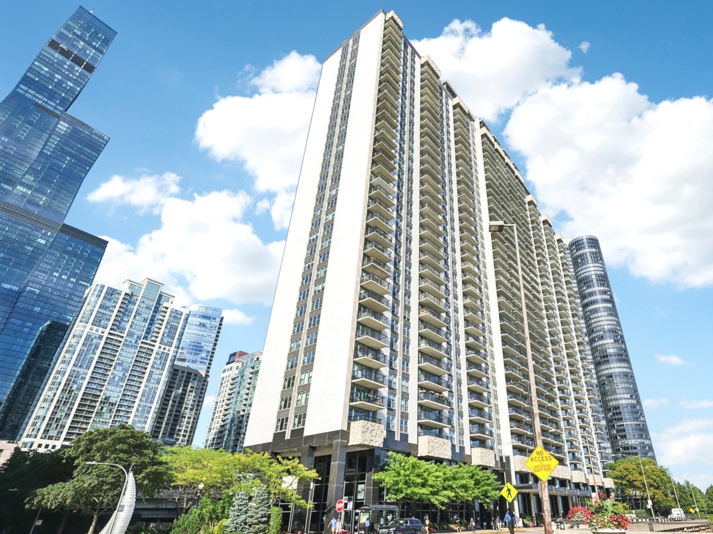 Spectacular Views from Every Direction, an Exceptional Combined Unit at Outer Drive East! Welcome to a rarely available, truly one-of-a-kind 4-bedroom, 4-bathroom residence, the exceptional combination of units #1119 and #1120 in the heart of Chicago's vibrant Lakeshore East. From the moment you enter through the impressive 15-foot long entryway that unfolds into a dramatic double foyer with both north and south exposures, you are greeted by walls of windows and two expansive balconies framing some of the city's most spectacular views. To the south, enjoy sweeping vistas of Monroe Harbor, Lake Shore Drive, Millennium Park, and the iconic skyline; to the north, the lush serenity of Lakeshore East Park and its architectural jewels. This is a home designed to inspire from every angle.  Combined and reimagined in 2023 with exquisite finishes, the residence is a showcase of modern luxury. Imported porcelain tile floors flow seamlessly throughout, illuminated by recessed smart lighting with customizable moods. Sleek glass pocket room dividing doors create flexible living spaces, while the kitchen impresses with quartz countertops, Italian cabinetry, Miele appliances, and a custom Scavolini wet bar crafted for grand entertaining, complete with a second refrigerator and dishwasher elegantly concealed within tempered glass cabinetry. Each of the four bathrooms is richly appointed with designer fixtures, vanities, and lighting, while one of the primary suites elevates daily living with heated floors and towel racks for ultimate comfort.  Life at Outer Drive East offers a luxury resort-style experience. Residents enjoy a sunlit fitness center, an indoor pool and whirlpool crowned by a striking architectural glass dome, an expansive outdoor sundeck with grilling areas, rejuvenating spa facilities with sauna and steam rooms, and courts for racquetball, basketball, and pickleball. Additional conveniences include stylish party rooms, a business center, on-site two restaurants and bar, salon, massage therapy, laundry facilities, and the assurance of 24/7 front desk and doorman service.  Set within the award-winning Lakeshore East community and designed by the renowned Reinheimer & Associates, this residence is ideally positioned to enjoy Chicago's finest. Just steps from Maggie Daley, Millennium Parks, Lakeshore East Park, the lakefront trail, the Riverwalk, the Museum Campus, world-class shopping on the Mag Mile, and the Loop's business hub, it places the city at your doorstep. More than a residence, it is a masterpiece in the sky, delivering an extraordinary lifestyle defined by beauty, sophistication, and Chicago's most iconic views.