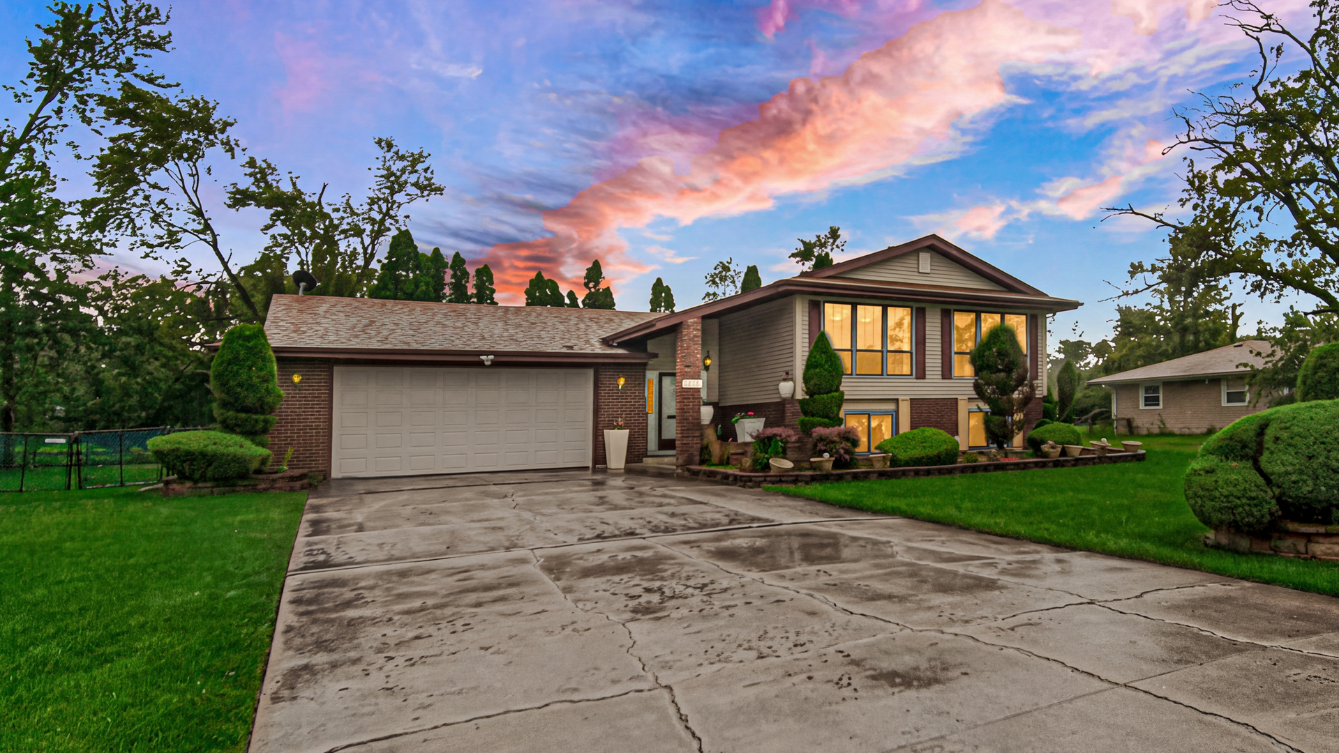 ***Owner is in the process of installing a new roof!***Outstanding space, serene park views, and immense potential come together at 4431 W 187th St! *** Set on a prime, expansive lot of nearly half an acre directly across from a peaceful park, this spacious split-level home offers 4 generously sized bedrooms, 3 full bathrooms, and an expansive walk-out lower level. The main level welcomes you with an open living and dining layout filled with natural light, alongside an eat-in kitchen with table space. Upstairs features three large bedrooms including a primary bedroom with private ensuite bath. The lower level offers an expansive 32x29 family/recreation room with a fireplace, a large 4th bedroom, full bath, and an oversized 10x20 laundry and utility area with walk-out access to the vast backyard patio. An attached 2.5-car heated garage with concrete driveway provides ample parking and workshop space. With major updates in place, the home offers the ideal canvas for new buyers to finish cosmetic touches and immediately build sweat equity. Conveniently located near Country Club Hills School District 160 schools and Rich Township High School, with fast access to I-57, I-80, and nearby Metra stations for an effortless Chicago commute.